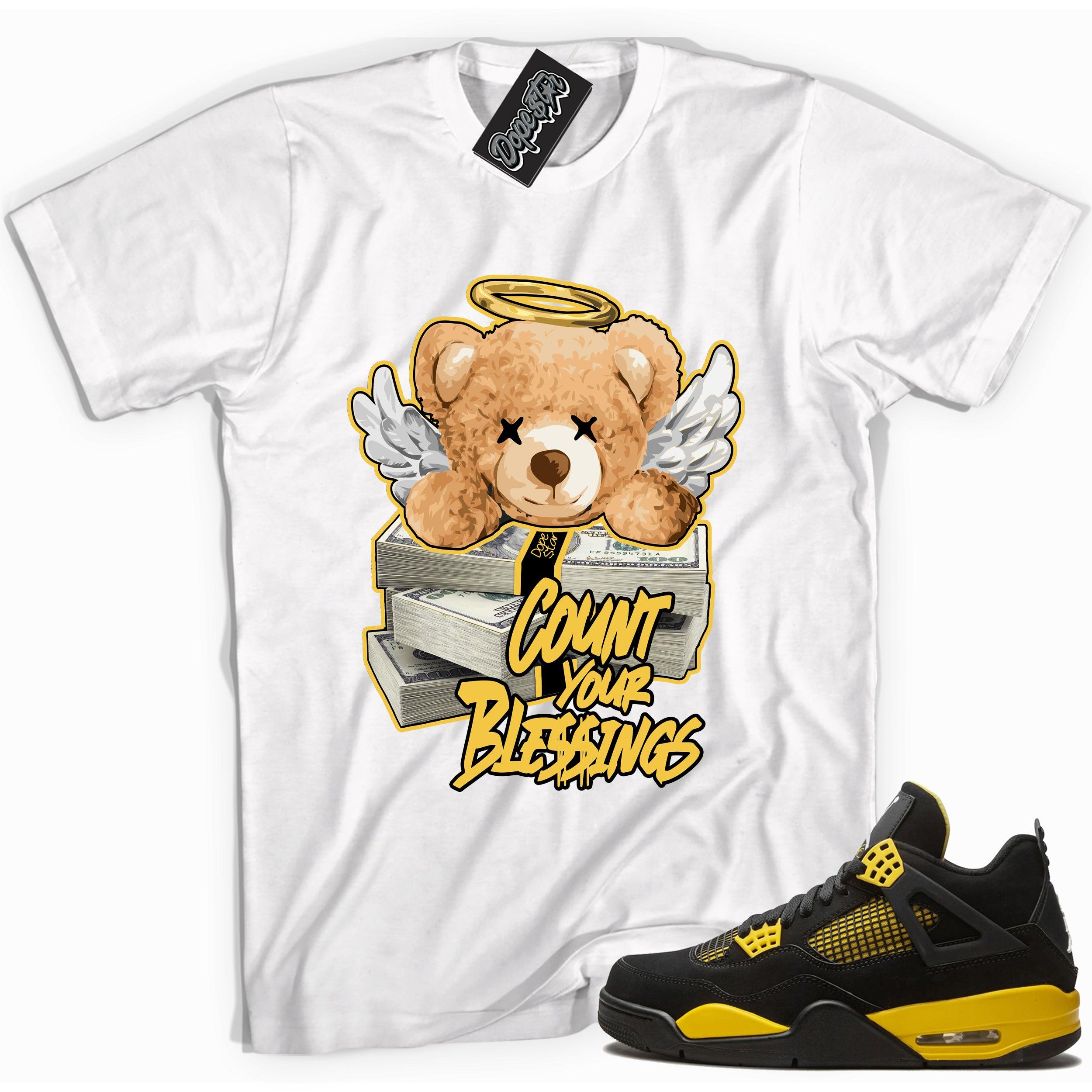 Cool white graphic tee with 'count your blessings' print, that perfectly matches Air Jordan 4 Thunder sneakers