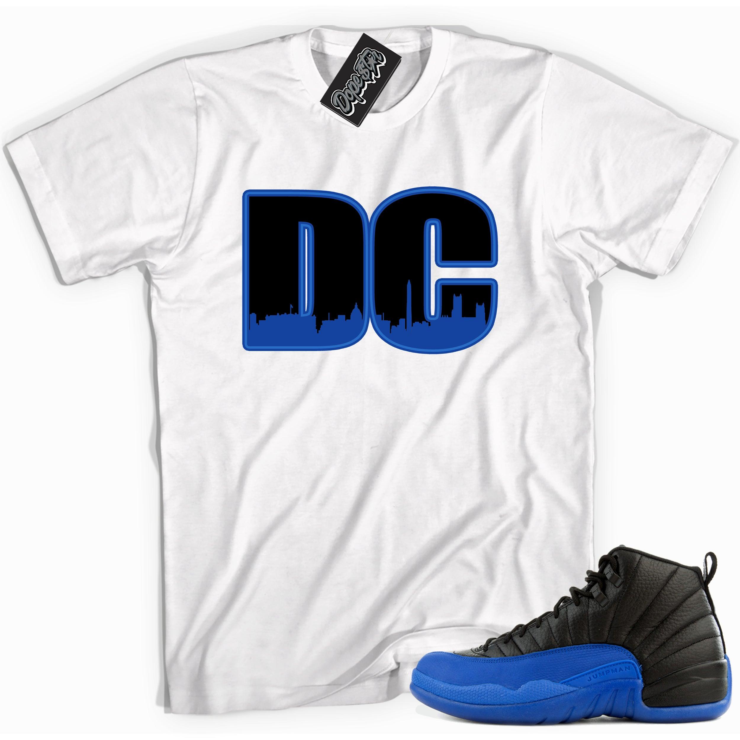 Cool white graphic tee with 'dc' print, that perfectly matches Air Jordan 12 Retro Black Game Royal sneakers.