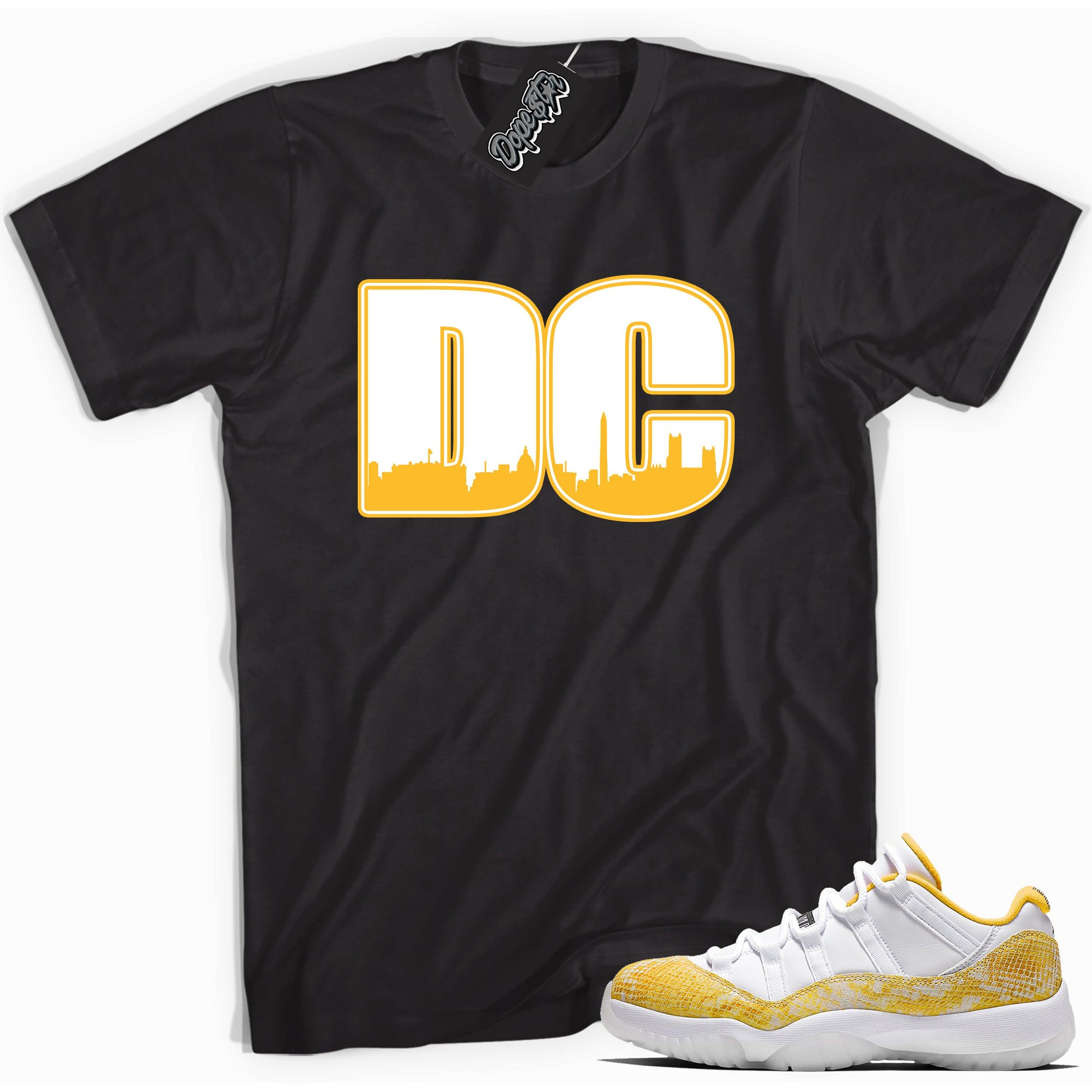 Cool black graphic tee with 'dc' print, that perfectly matches  Air Jordan 11 Low Yellow Snakeskin sneakers