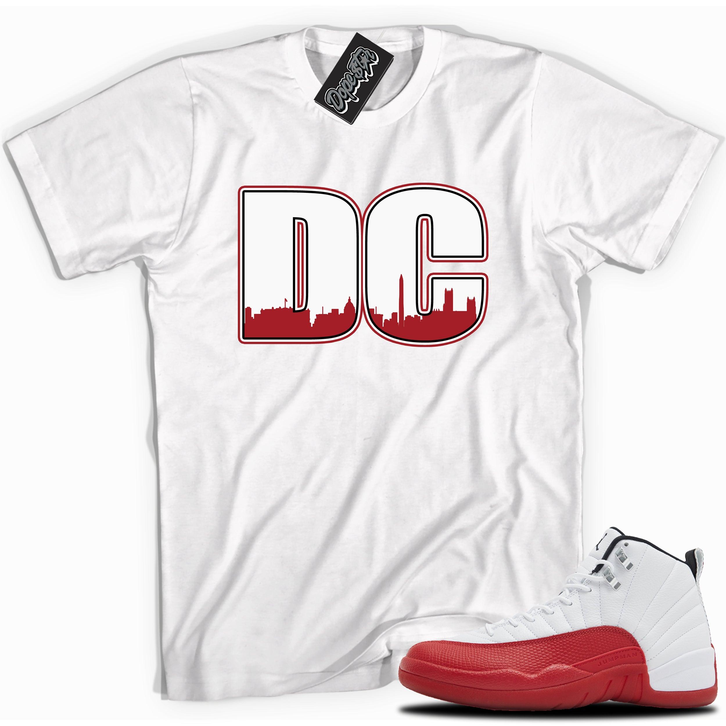 Cool White graphic tee with “ DC ” print, that perfectly matches Air Jordan 12 Retro Cherry Red 2023 red and white sneakers 