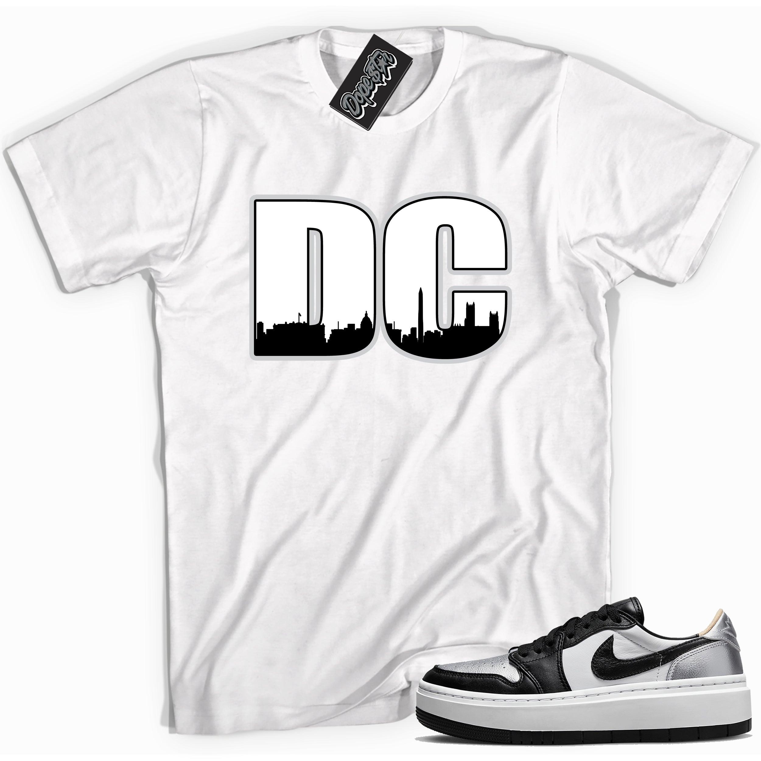 Cool white graphic tee with 'DC' print, that perfectly matches Air Jordan 1 Elevate Low SE Silver Toe sneakers.