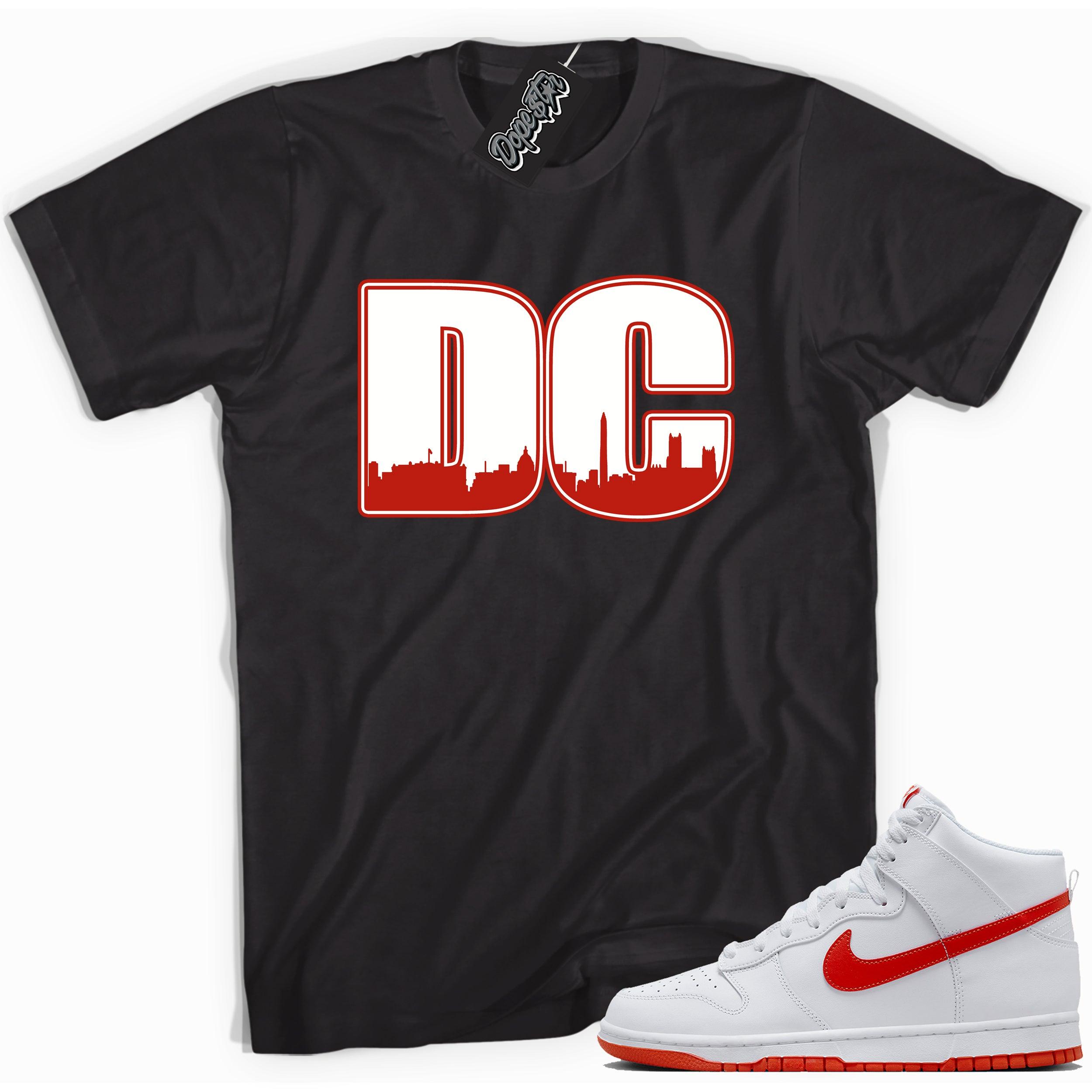 Cool black graphic tee with 'DC' print, that perfectly matches Nike Dunk High White Picante Red sneakers.
