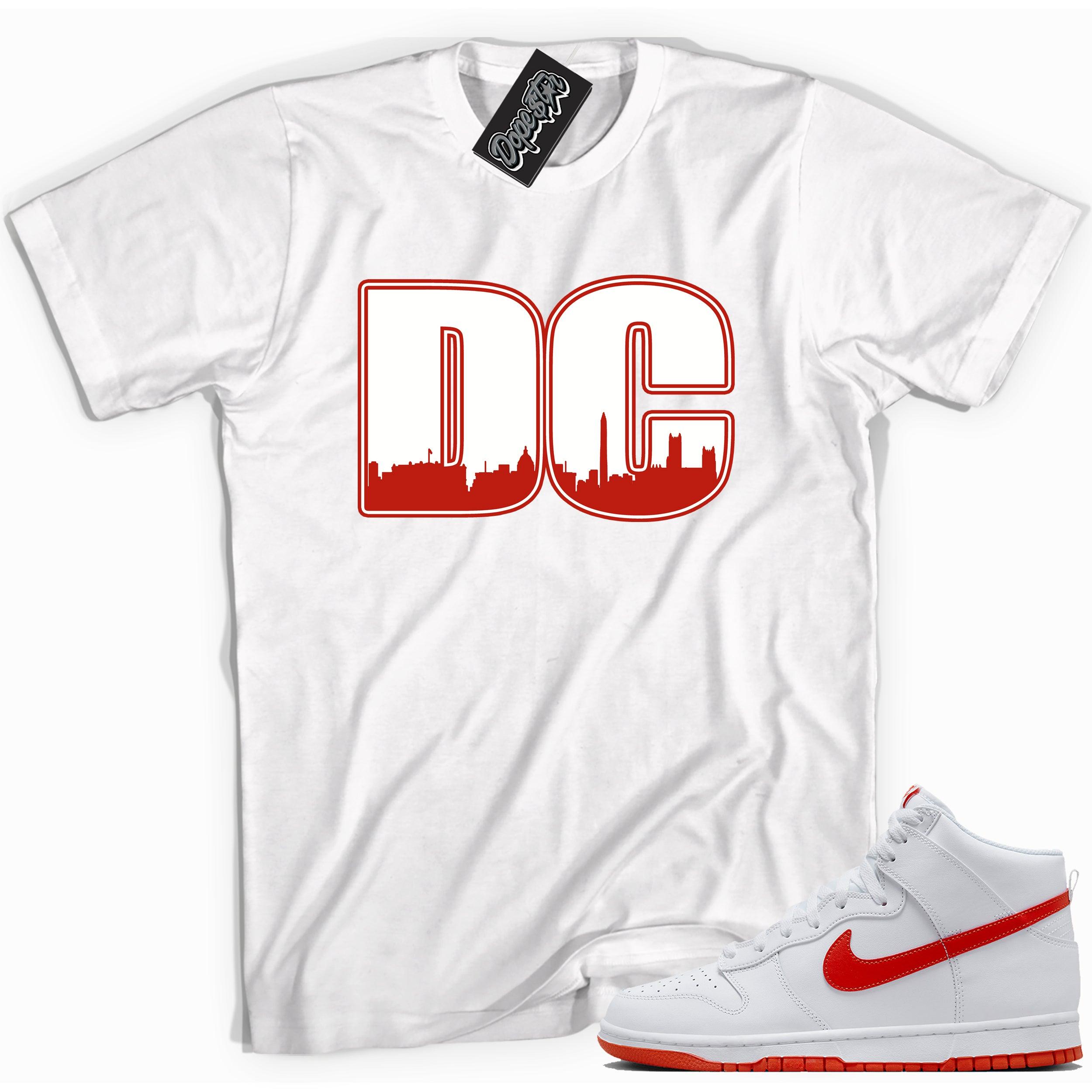 Cool white graphic tee with 'DC' print, that perfectly matches Nike Dunk High White Picante Red sneakers.
