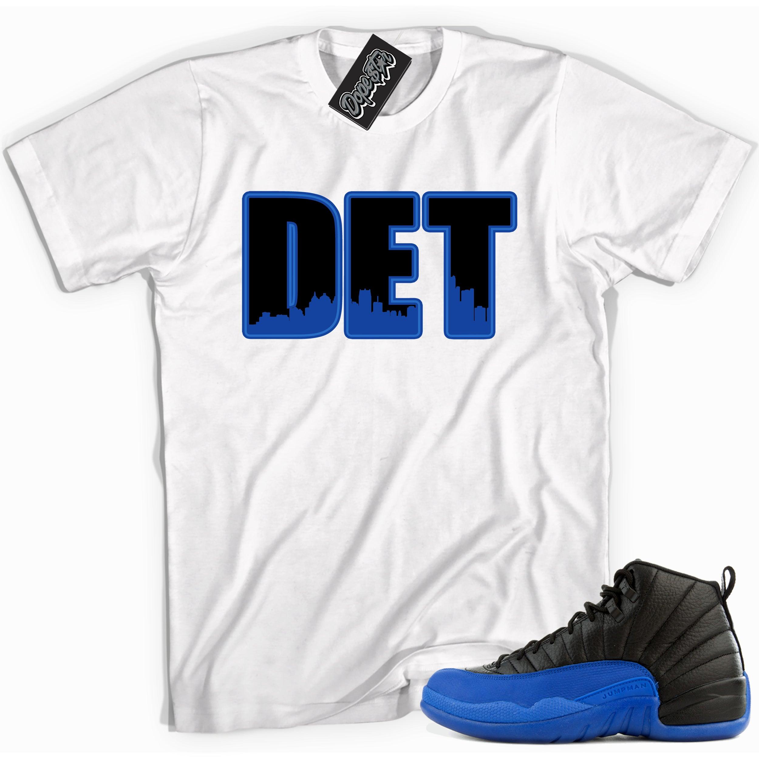 Cool white graphic tee with 'det' print, that perfectly matches Air Jordan 12 Retro Black Game Royal sneakers.