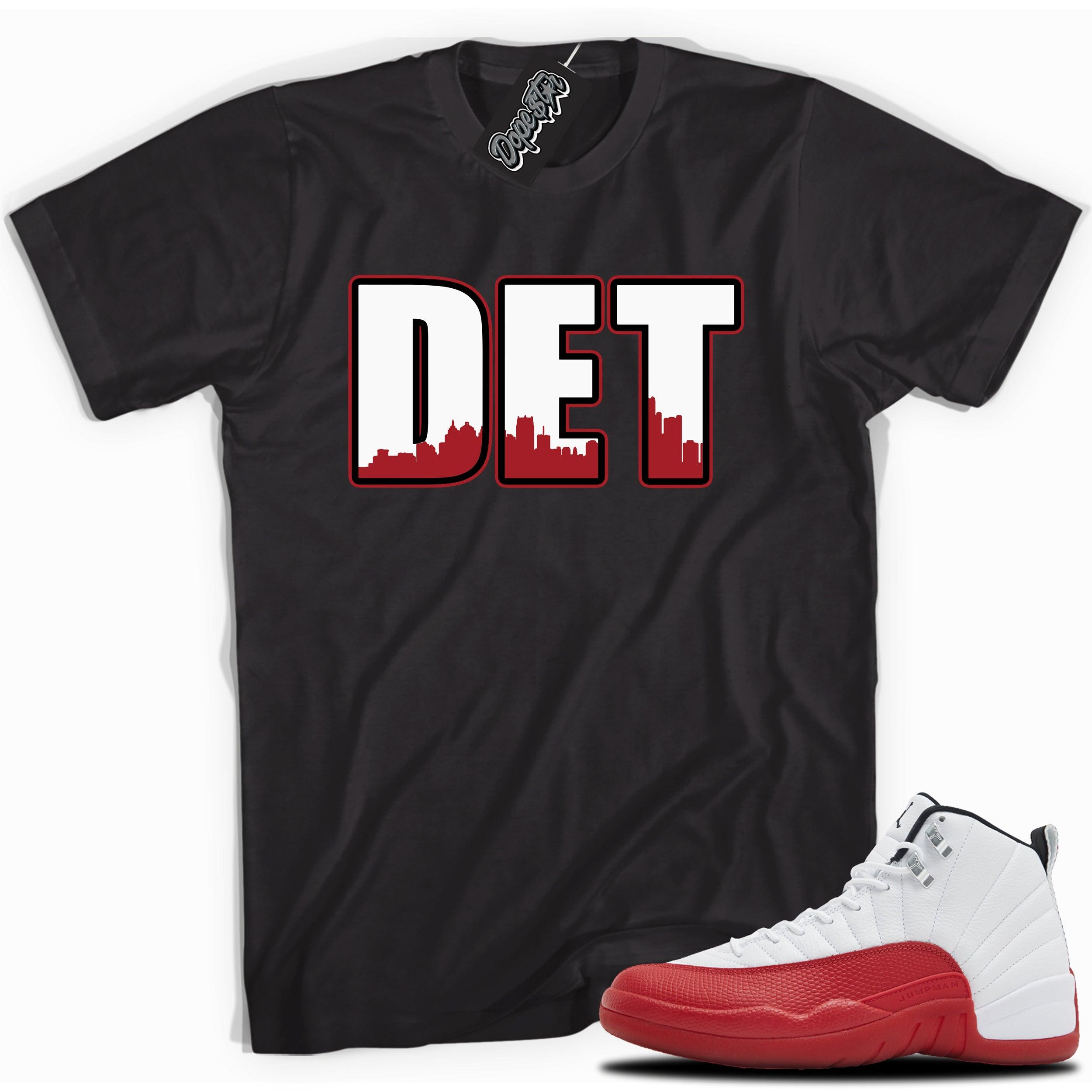 Cool Black graphic tee with “ DETROIT ” print, that perfectly matches Air Jordan 12 Retro Cherry Red 2023 red and white sneakers 