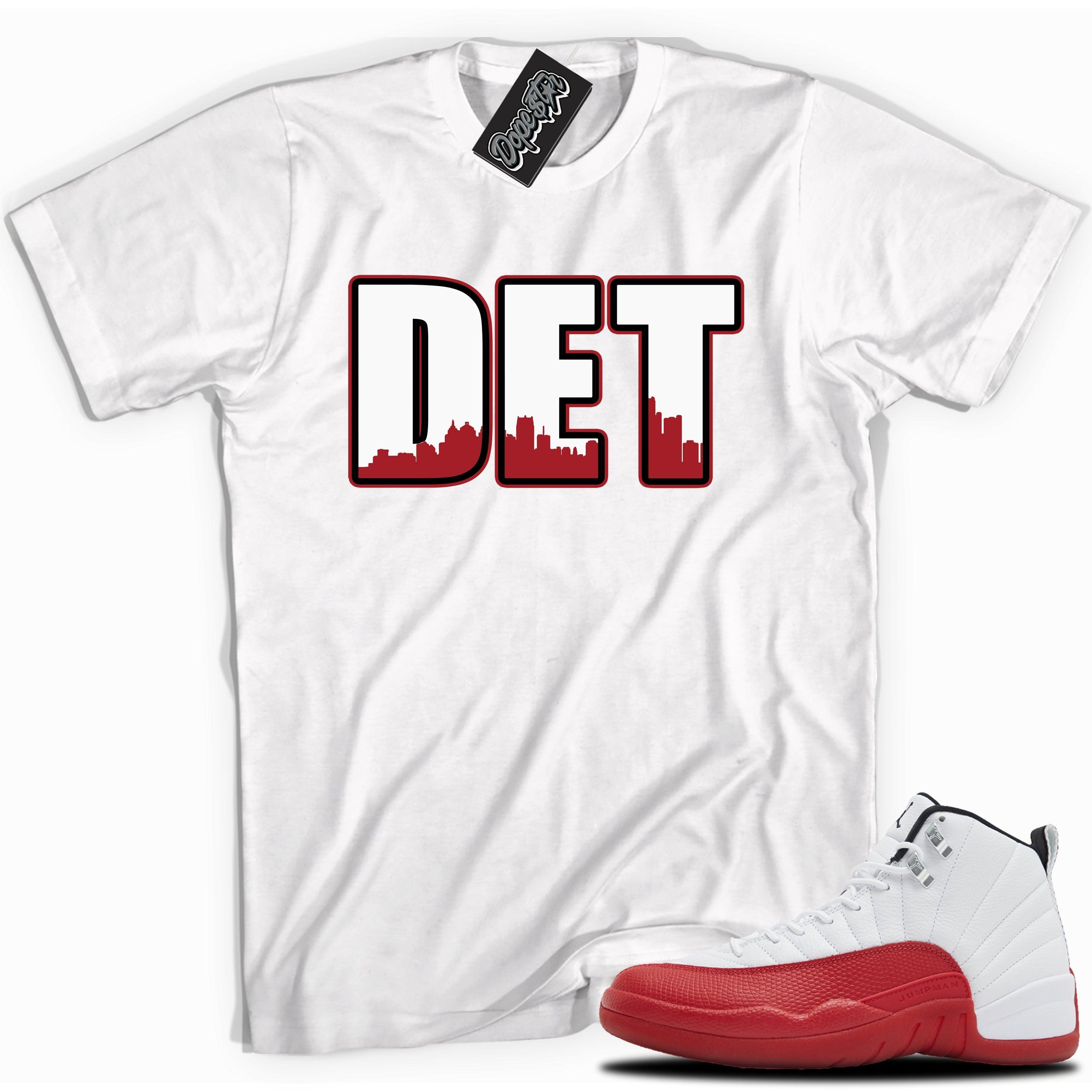Cool White graphic tee with “ DETROIT ” print, that perfectly matches Air Jordan 12 Retro Cherry Red 2023 red and white sneakers 