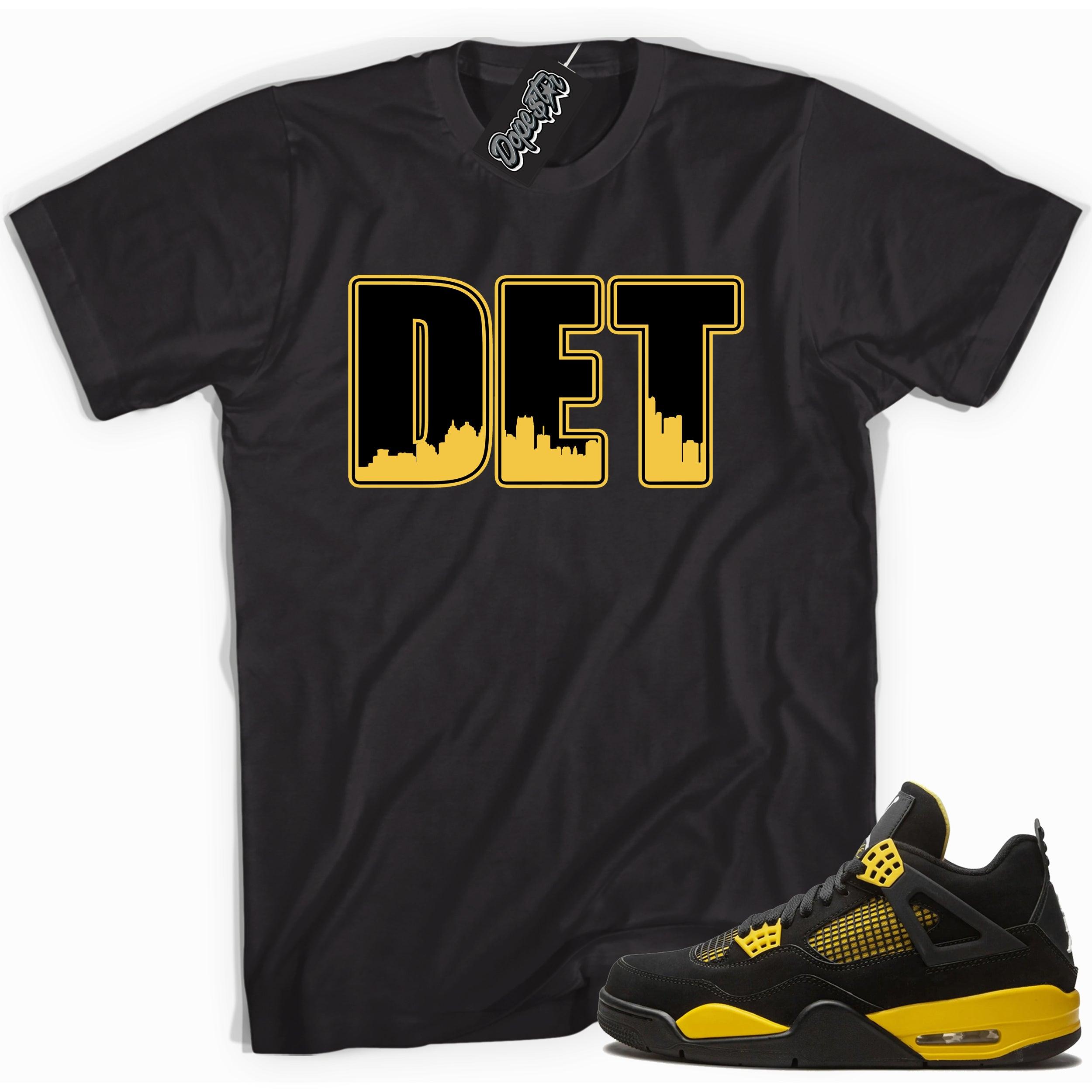 Cool black graphic tee with 'DETROIT' print, that perfectly matches  Air Jordan 4 Thunder sneakers