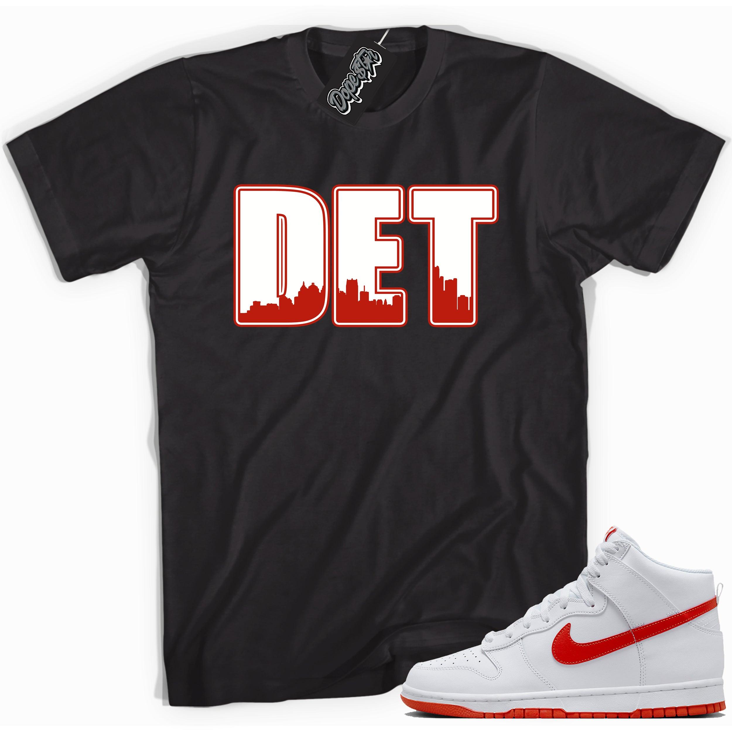 Cool black graphic tee with 'Detroit' print, that perfectly matches Nike Dunk High White Picante Red sneakers.