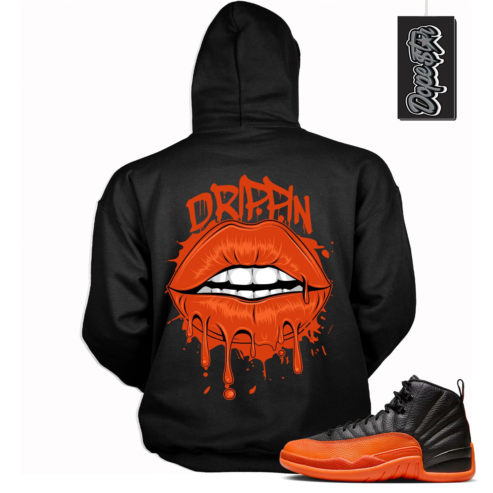 Cool Black Graphic Hoodie with “ Drippin Lips “ print, that perfectly matches Air Jordan 12 Retro WNBA All-Star Brilliant Orange  sneakers