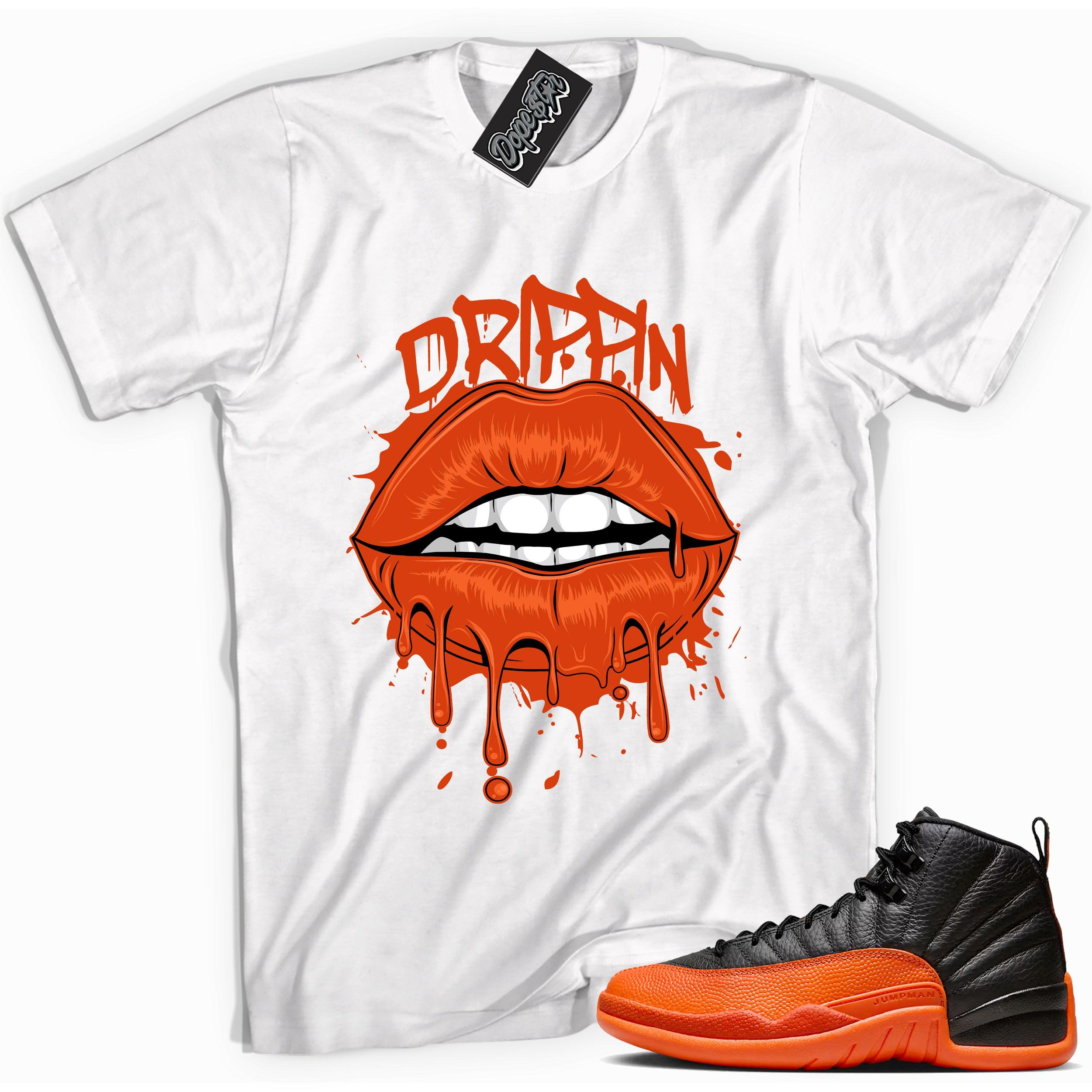 Cool White graphic tee with “ Drippin Lips ” print, that perfectly matches Air Jordan 12 Retro WNBA All-Star Brilliant Orange sneakers 
