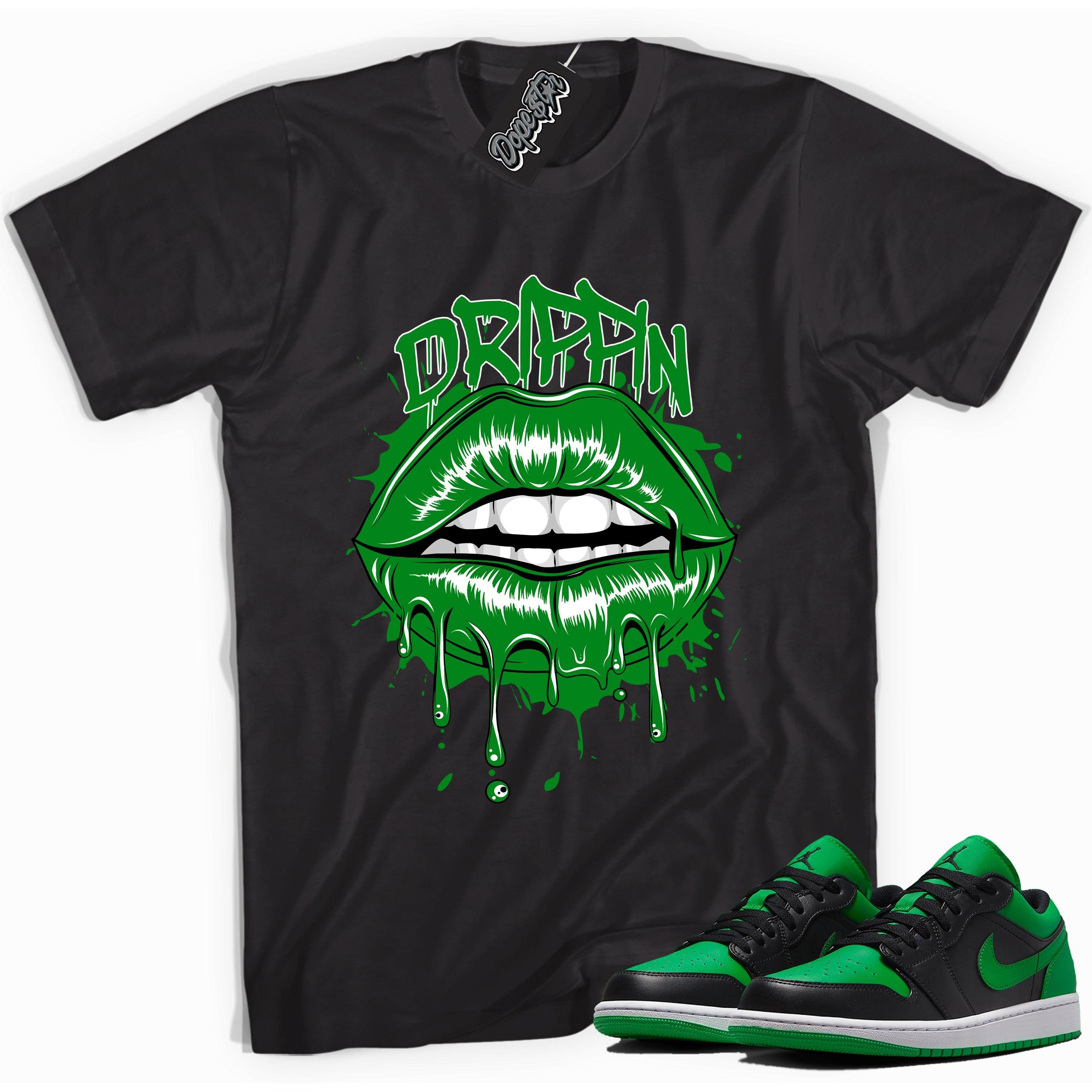 Cool black graphic tee with 'Drippin' print, that perfectly matches Air Jordan 1 Low Lucky Green sneakers