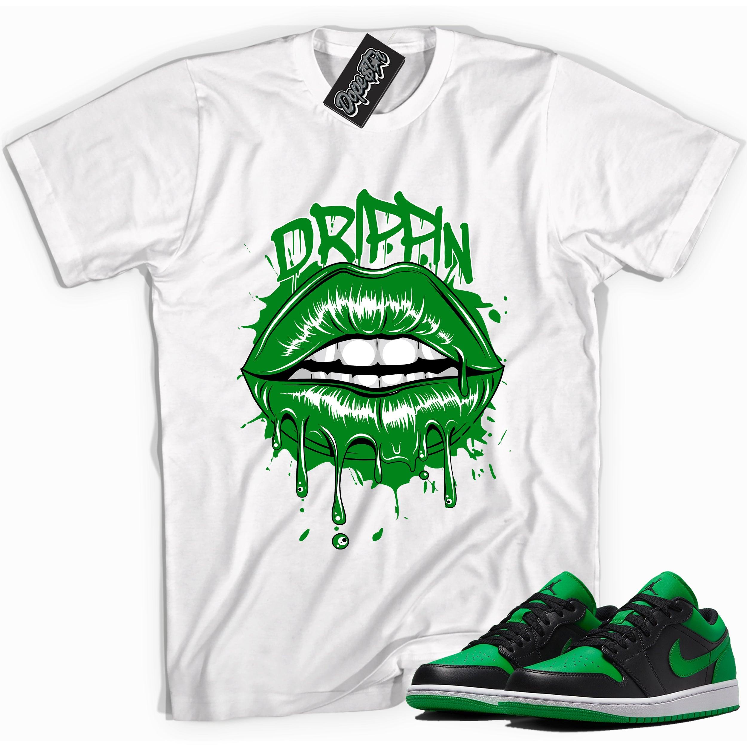 Cool white graphic tee with 'Drippin' print, that perfectly matches Air Jordan 1 Low Lucky Green sneakers