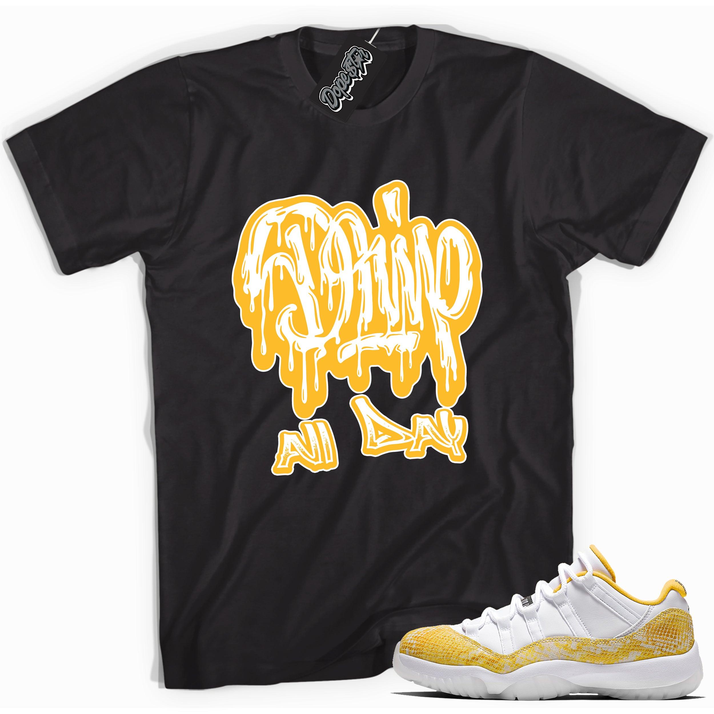 Cool black graphic tee with 'drip all day' print, that perfectly matches  Air Jordan 11 Low Yellow Snakeskin sneakers