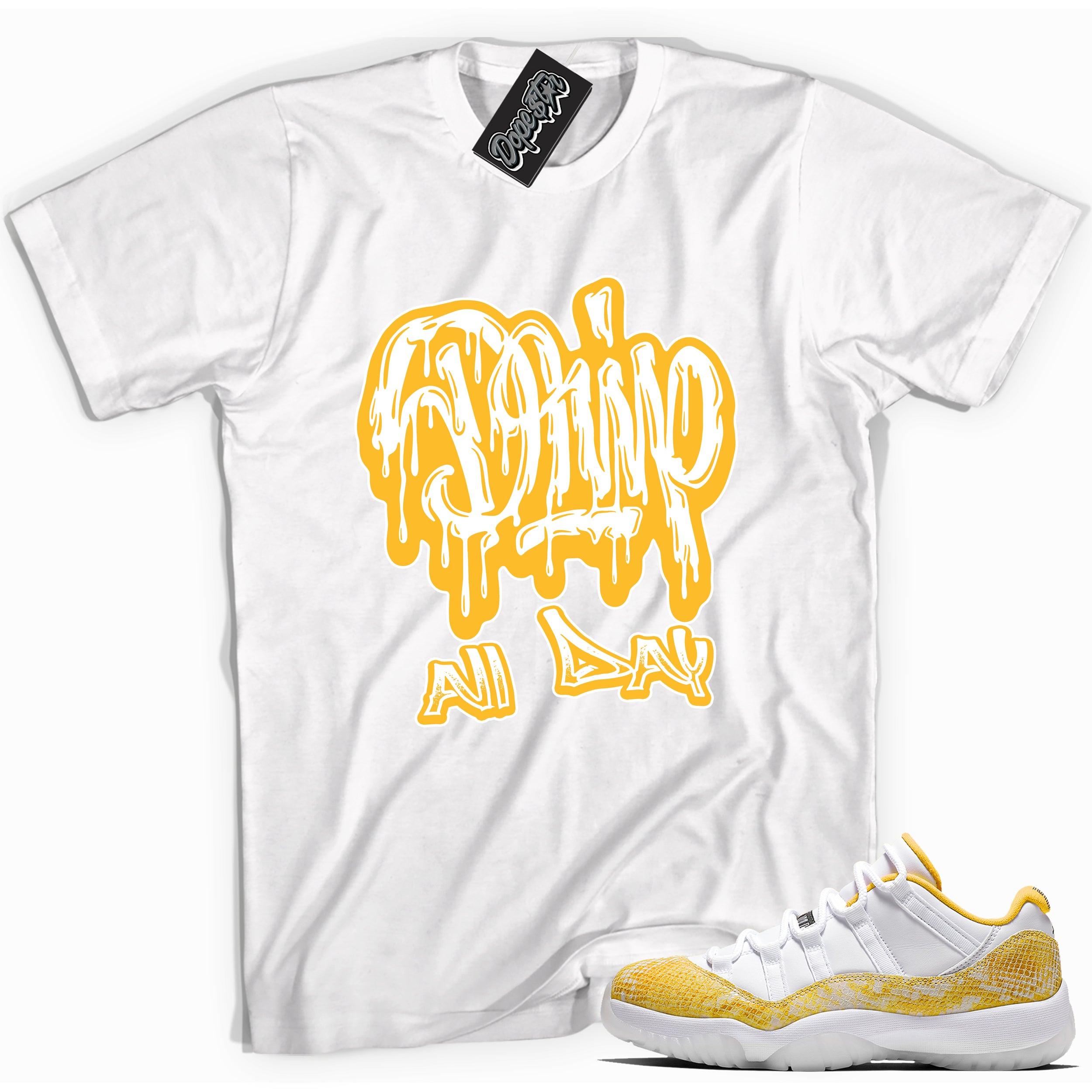 Cool white graphic tee with 'drip all day' print, that perfectly matches Air Jordan 11 Low Yellow Snakeskin sneakers