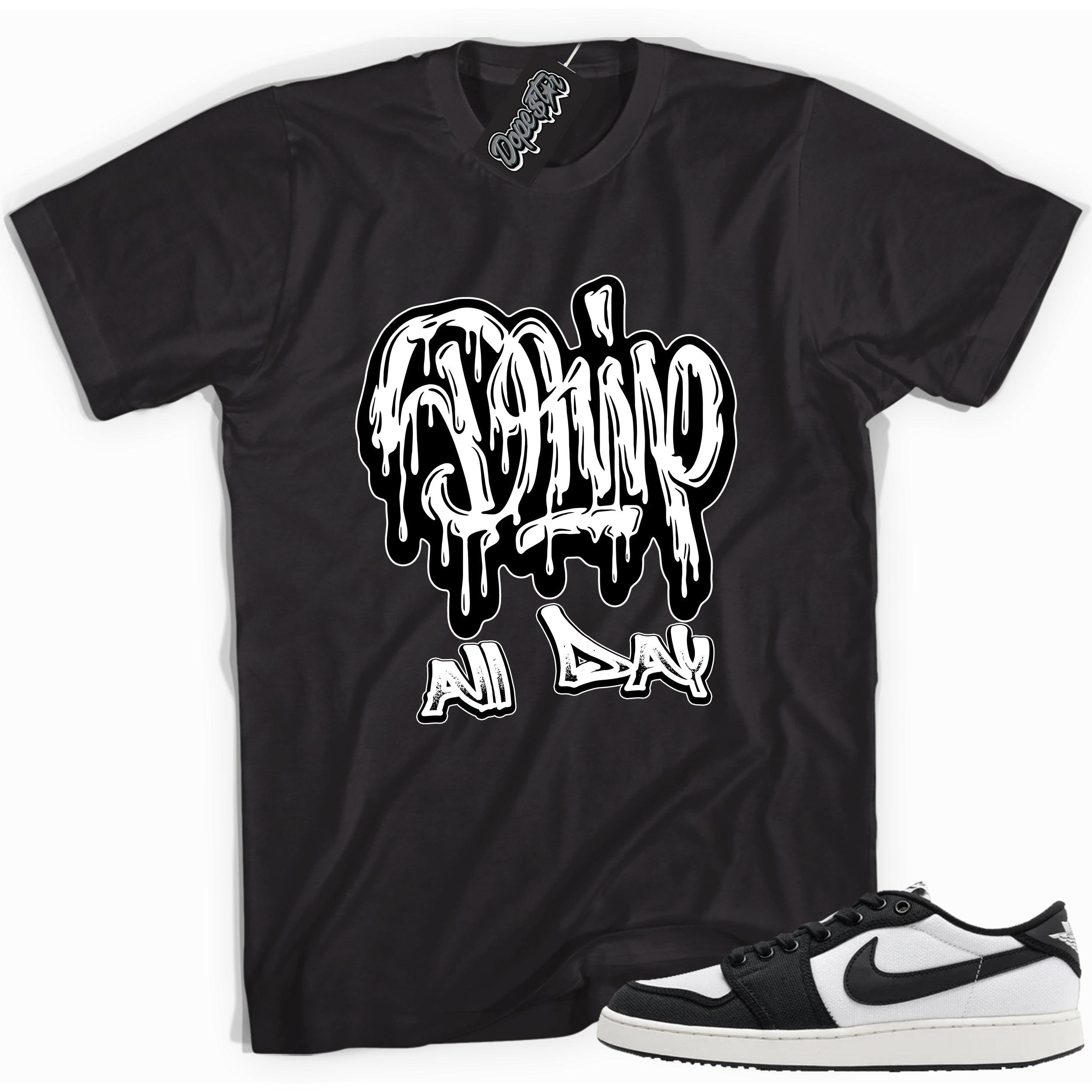 Cool black graphic tee with 'drip all day' print, that perfectly matches Air Jordan 1 Retro Ajko Low Black & White sneakers.