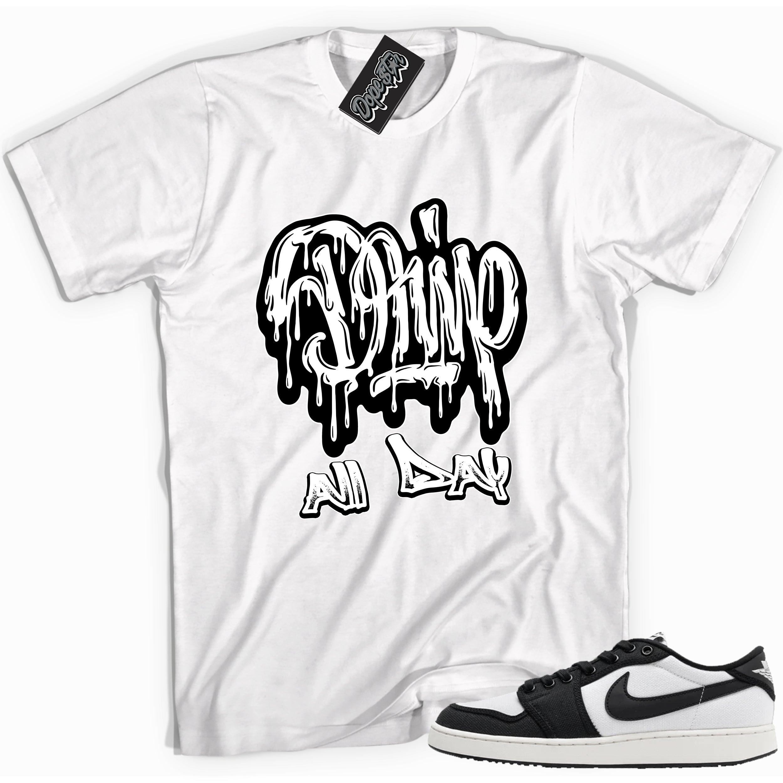 Cool white graphic tee with 'drip all day' print, that perfectly matches Air Jordan 1 Retro Ajko Low Black & White sneakers.