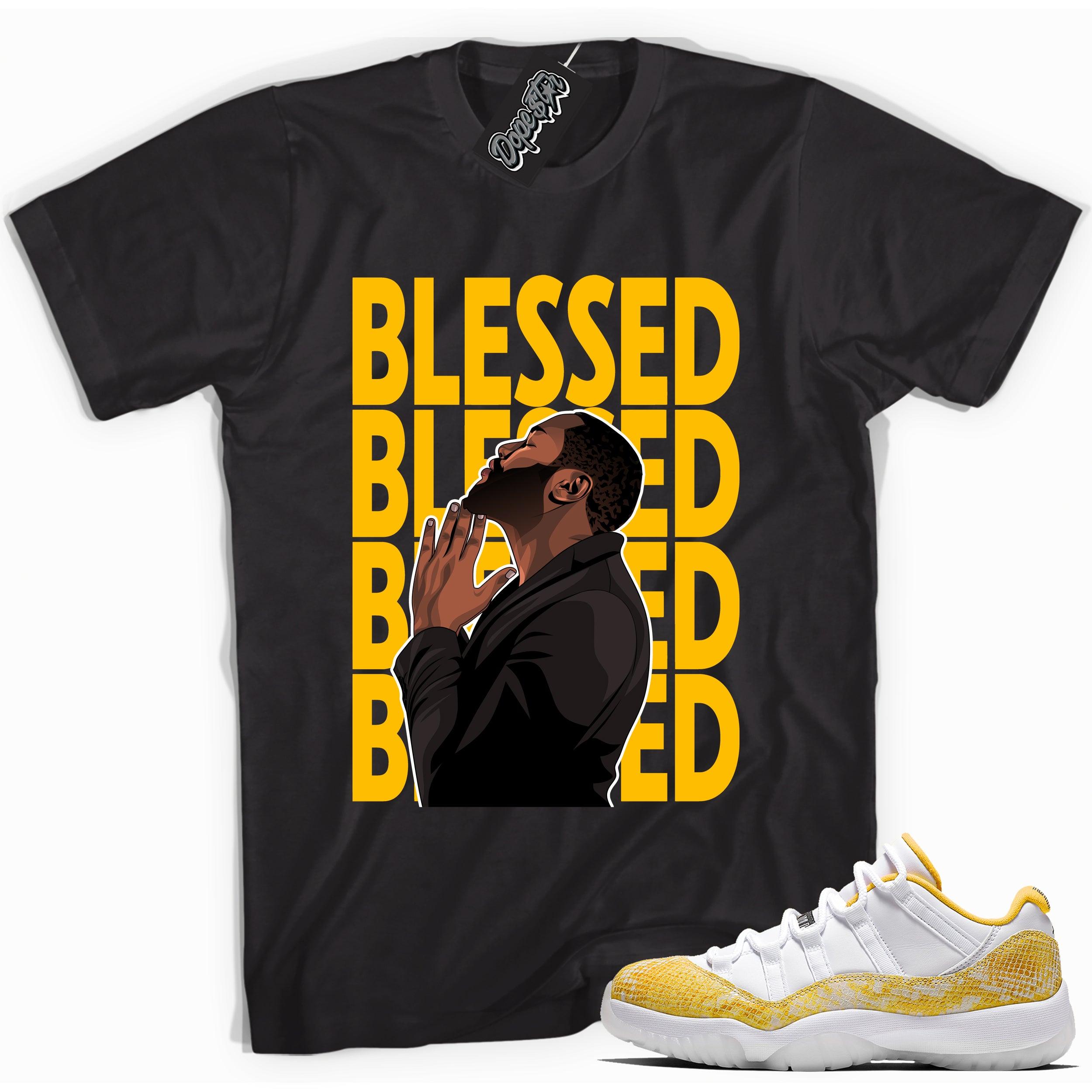 Cool black graphic tee with 'god blessed' print, that perfectly matches  Air Jordan 11 Low Yellow Snakeskin sneakers