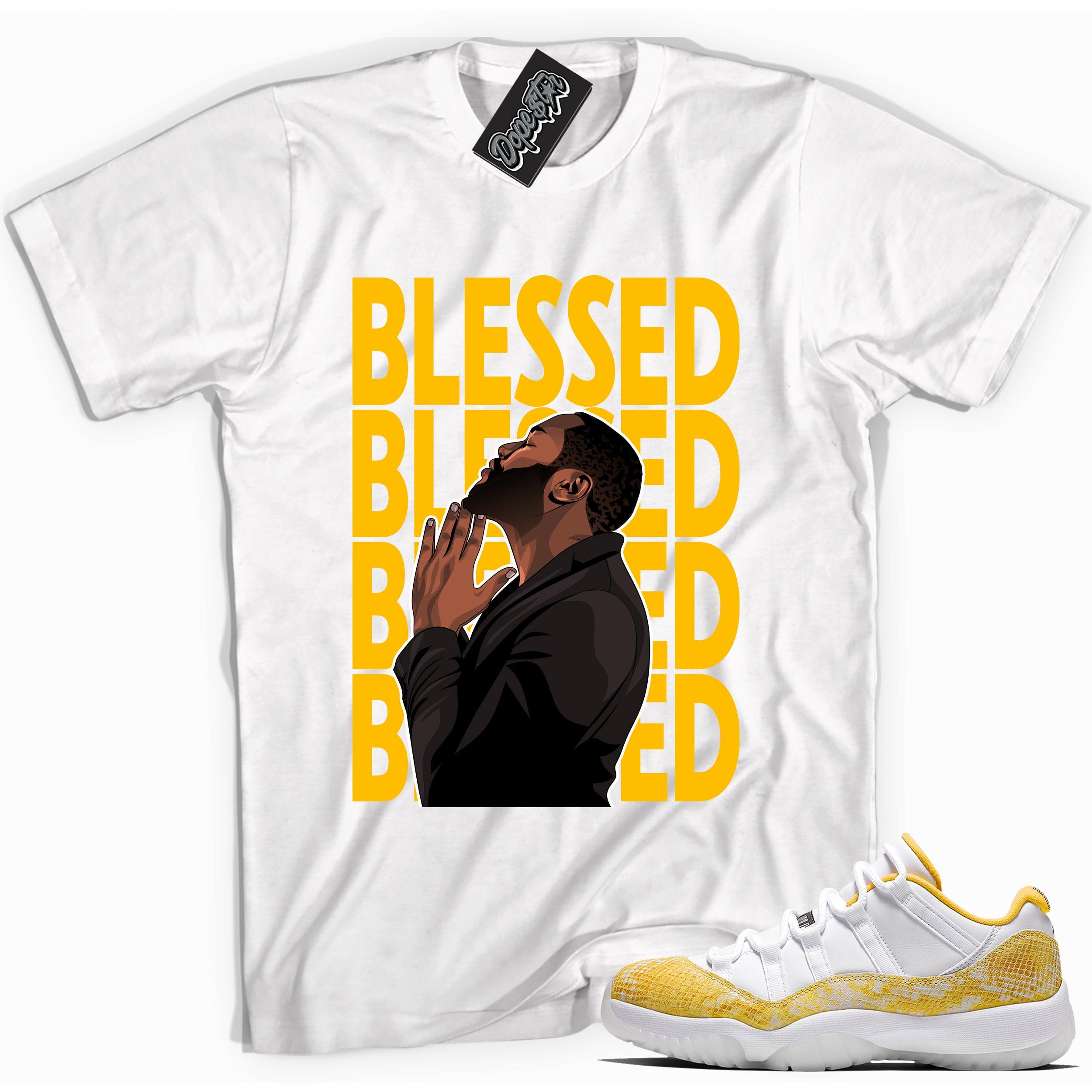 Cool white graphic tee with 'god blessed' print, that perfectly matches Air Jordan 11 Low Yellow Snakeskin sneakers