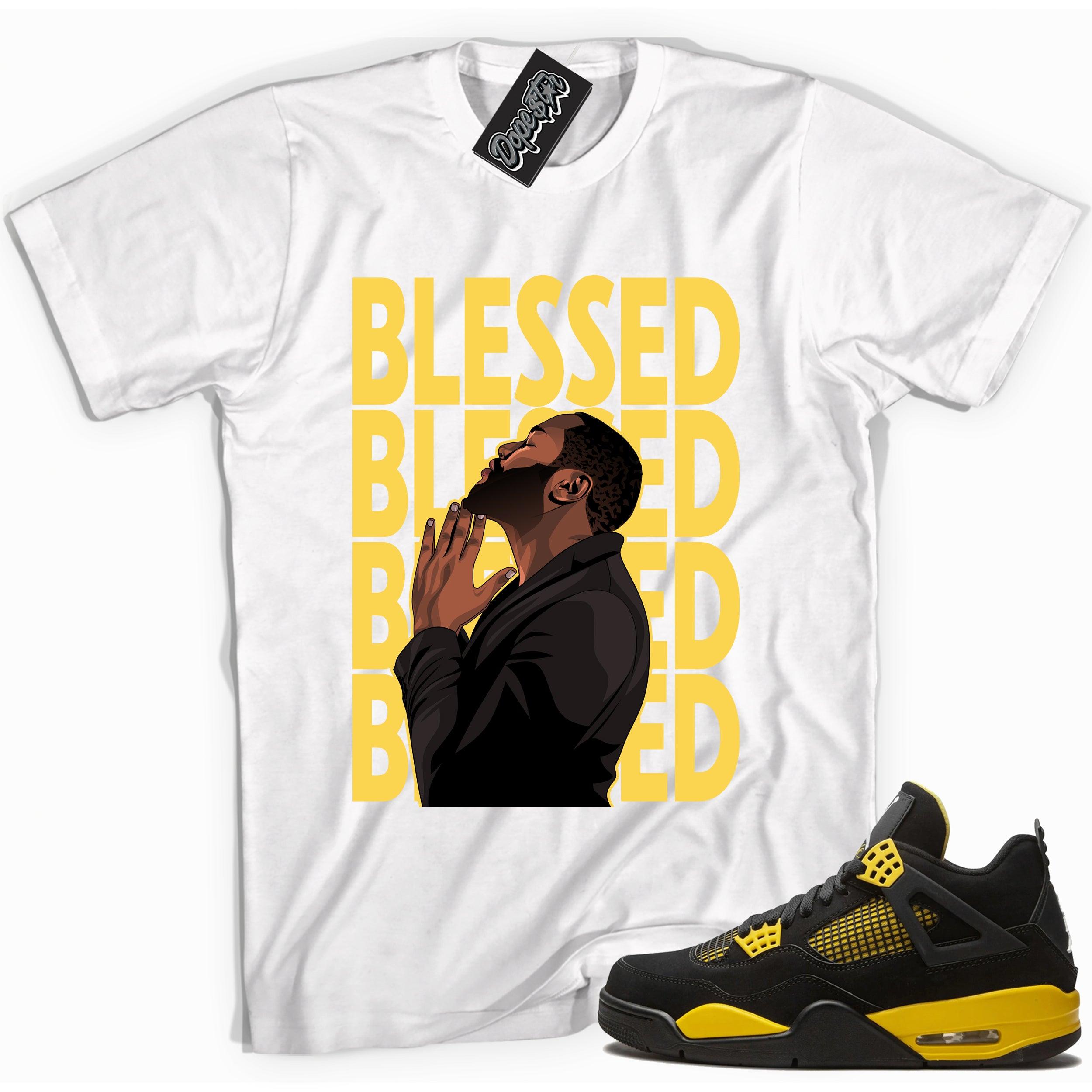 Cool white graphic tee with 'god blessed' print, that perfectly matches Air Jordan 4 Thunder sneakers