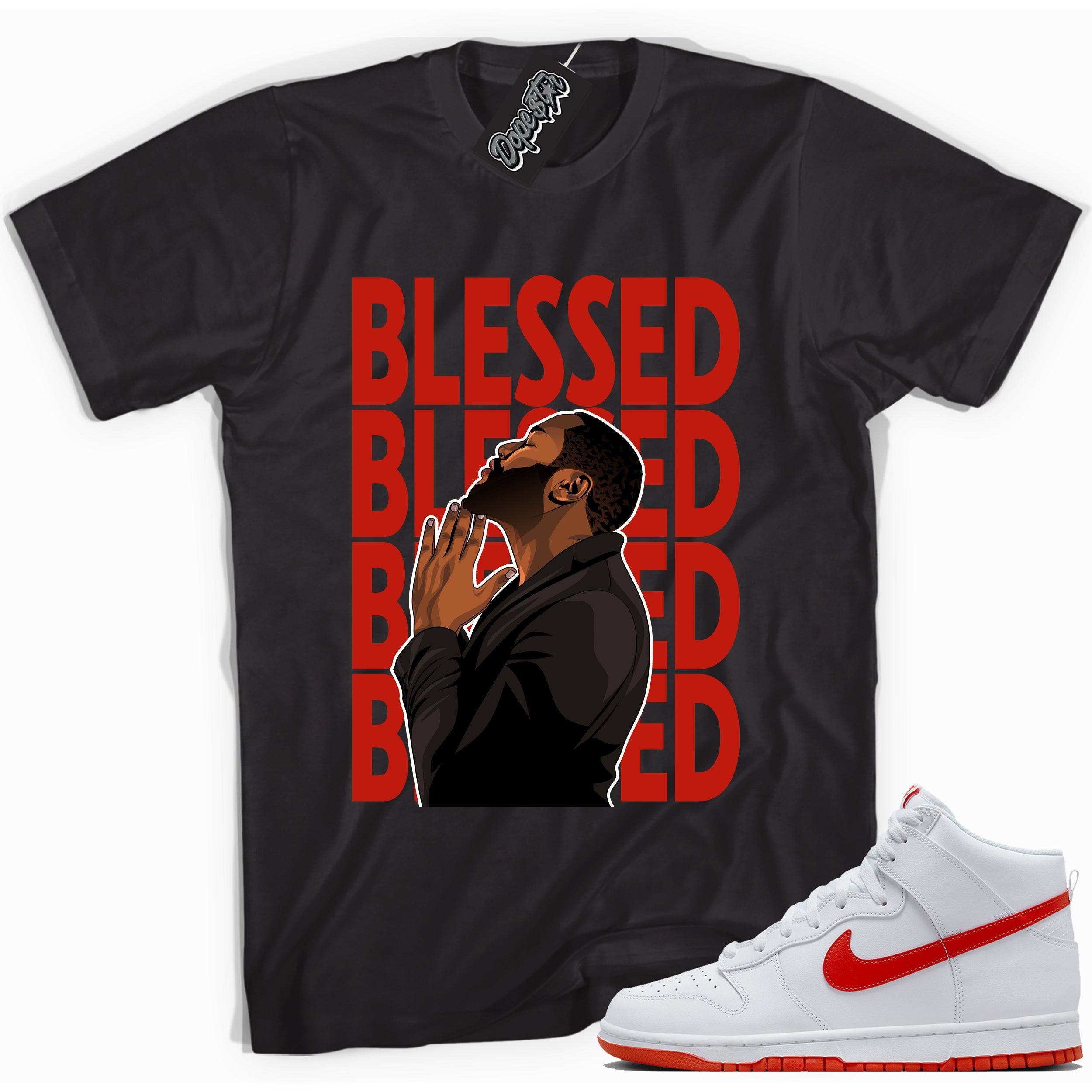 Cool black graphic tee with 'god blessed' print, that perfectly matches Nike Dunk High White Picante Red sneakers.
