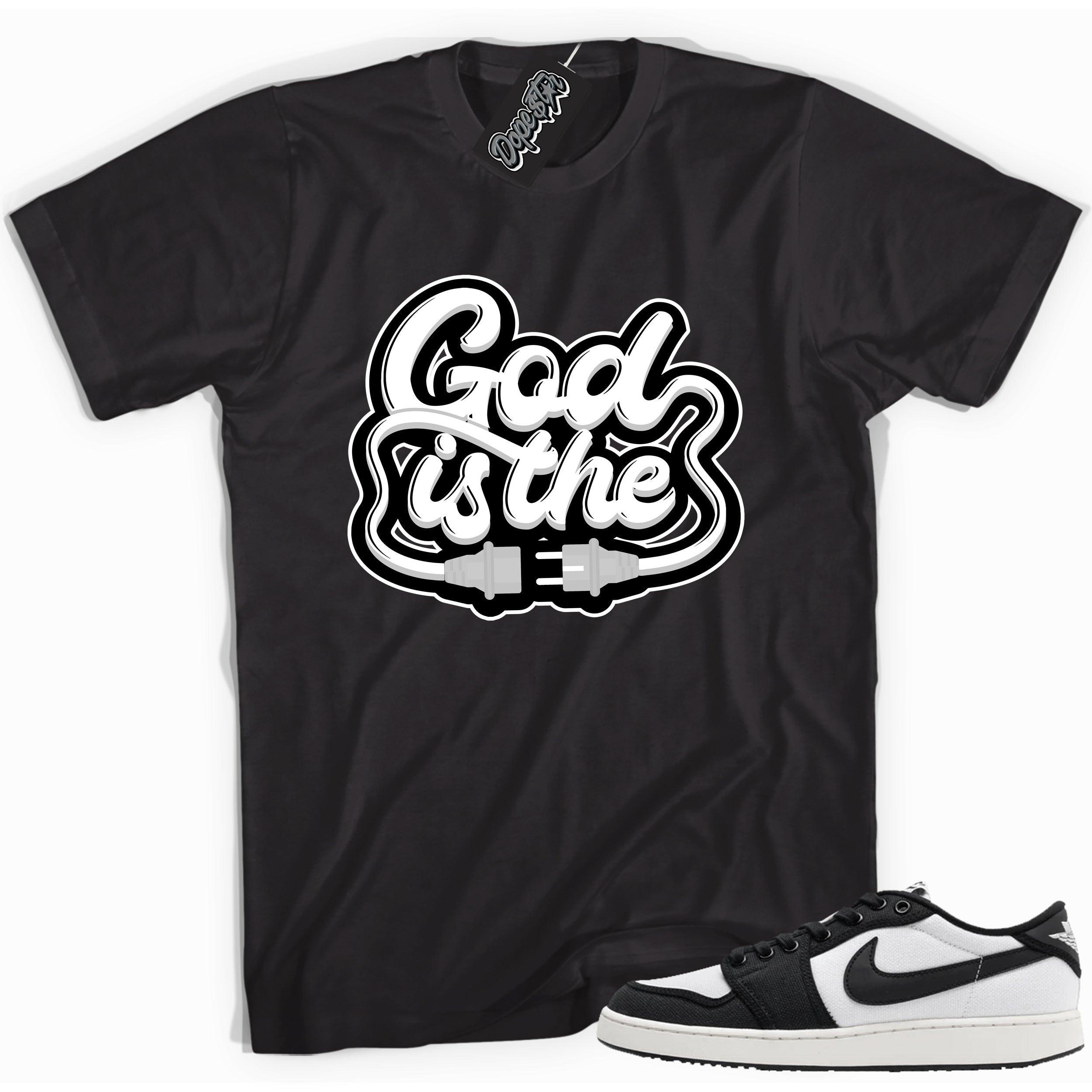 Cool black graphic tee with 'god is the plug' print, that perfectly matches Air Jordan 1 Retro Ajko Low Black & White sneakers.