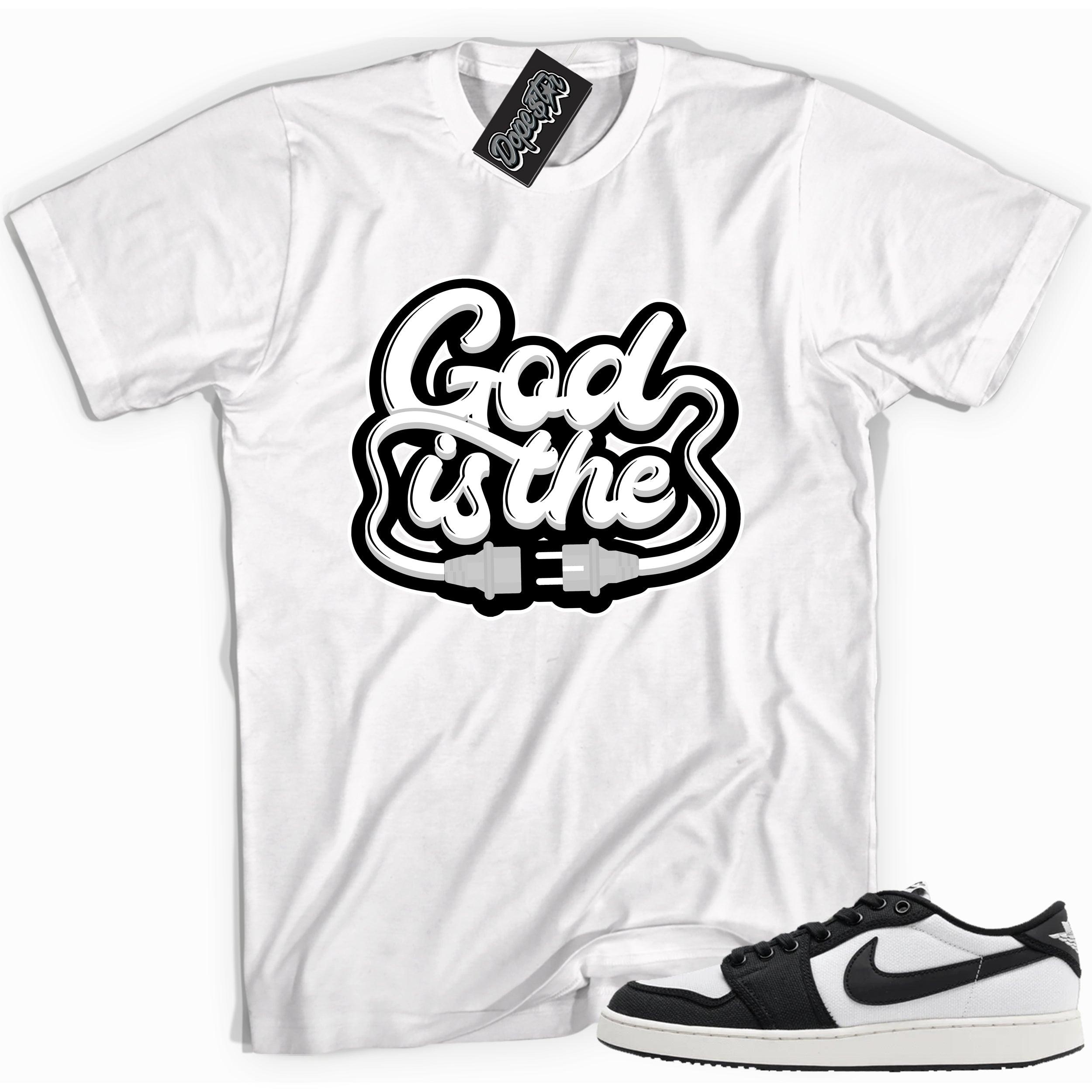 Cool white graphic tee with 'god is the plug' print, that perfectly matches Air Jordan 1 Retro Ajko Low Black & White sneakers.
