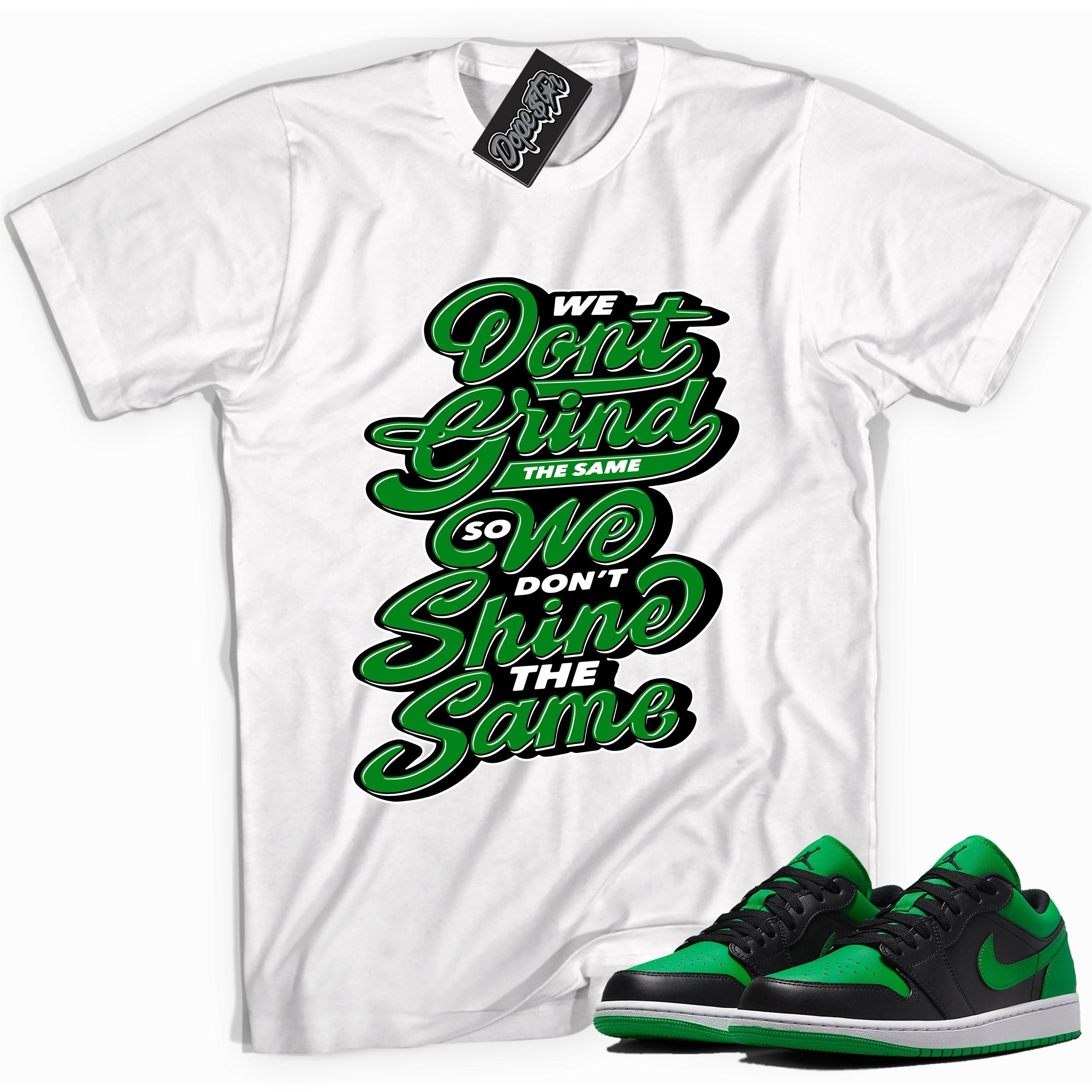 Cool white graphic tee with 'We Don't Grind The Same' print, that perfectly matches Air Jordan 1 Low Lucky Green sneakers