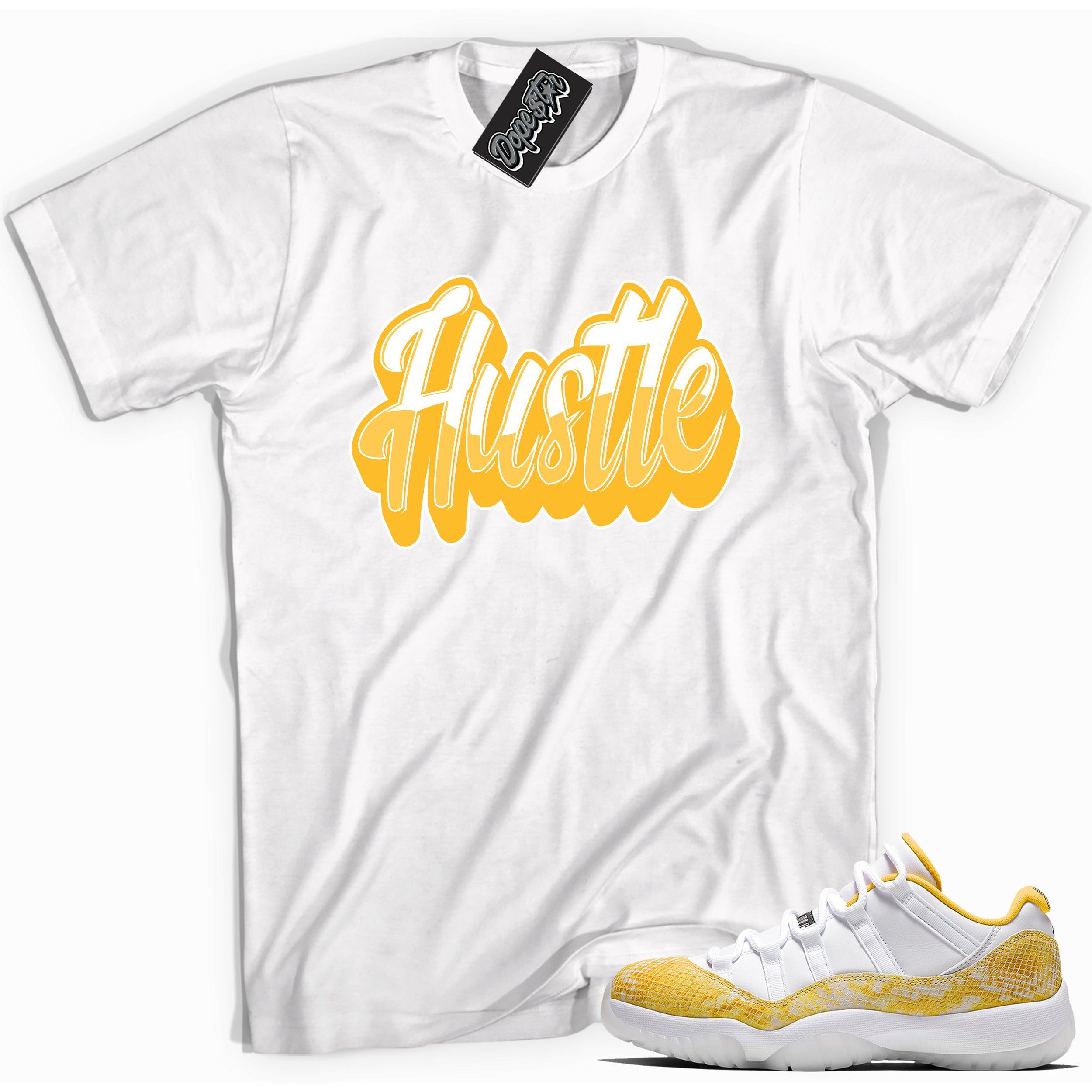 Cool white graphic tee with 'hustle' print, that perfectly matches Air Jordan 11 Low Yellow Snakeskin sneakers