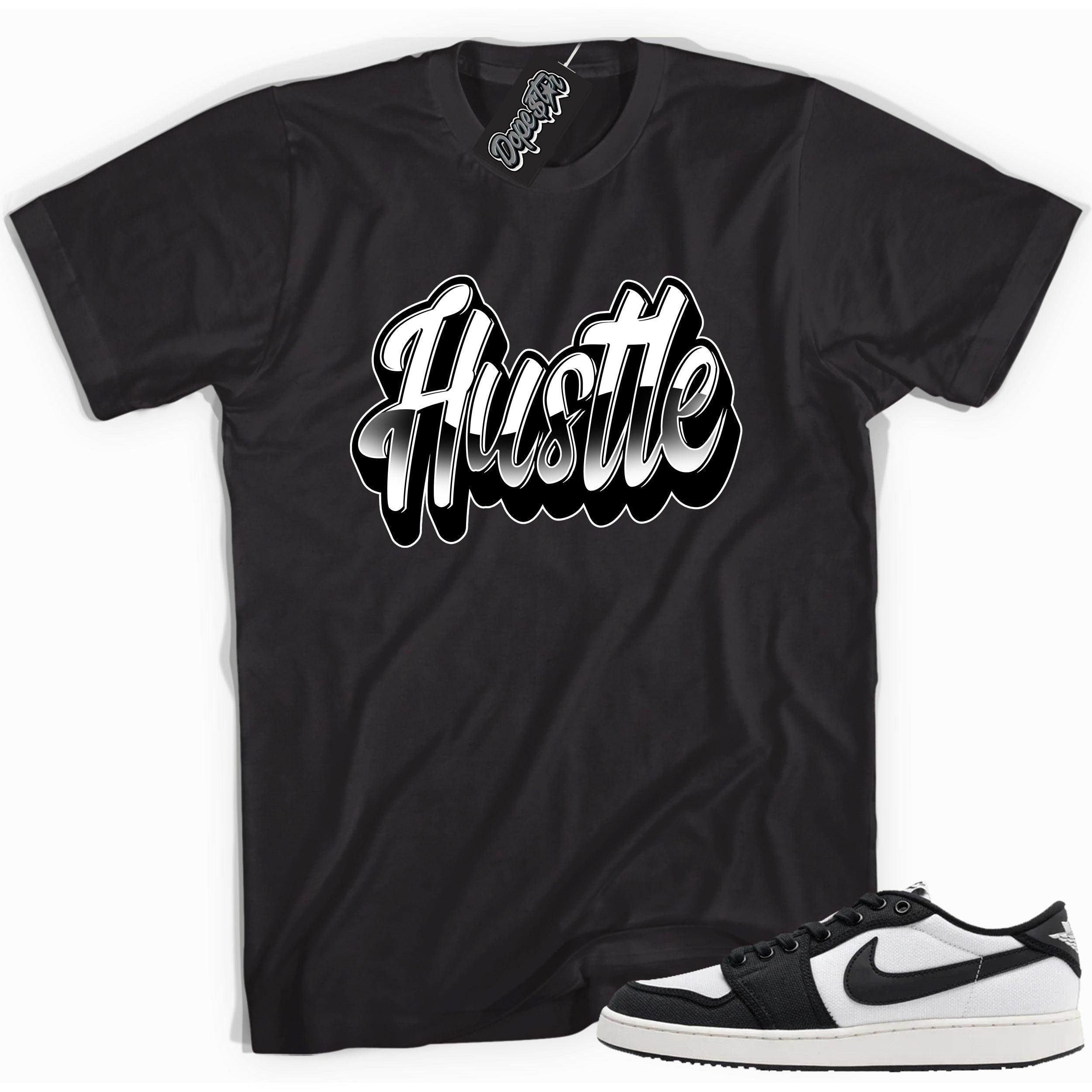 Cool black graphic tee with 'hustle' print, that perfectly matches Air Jordan 1 Retro Ajko Low Black & White sneakers.