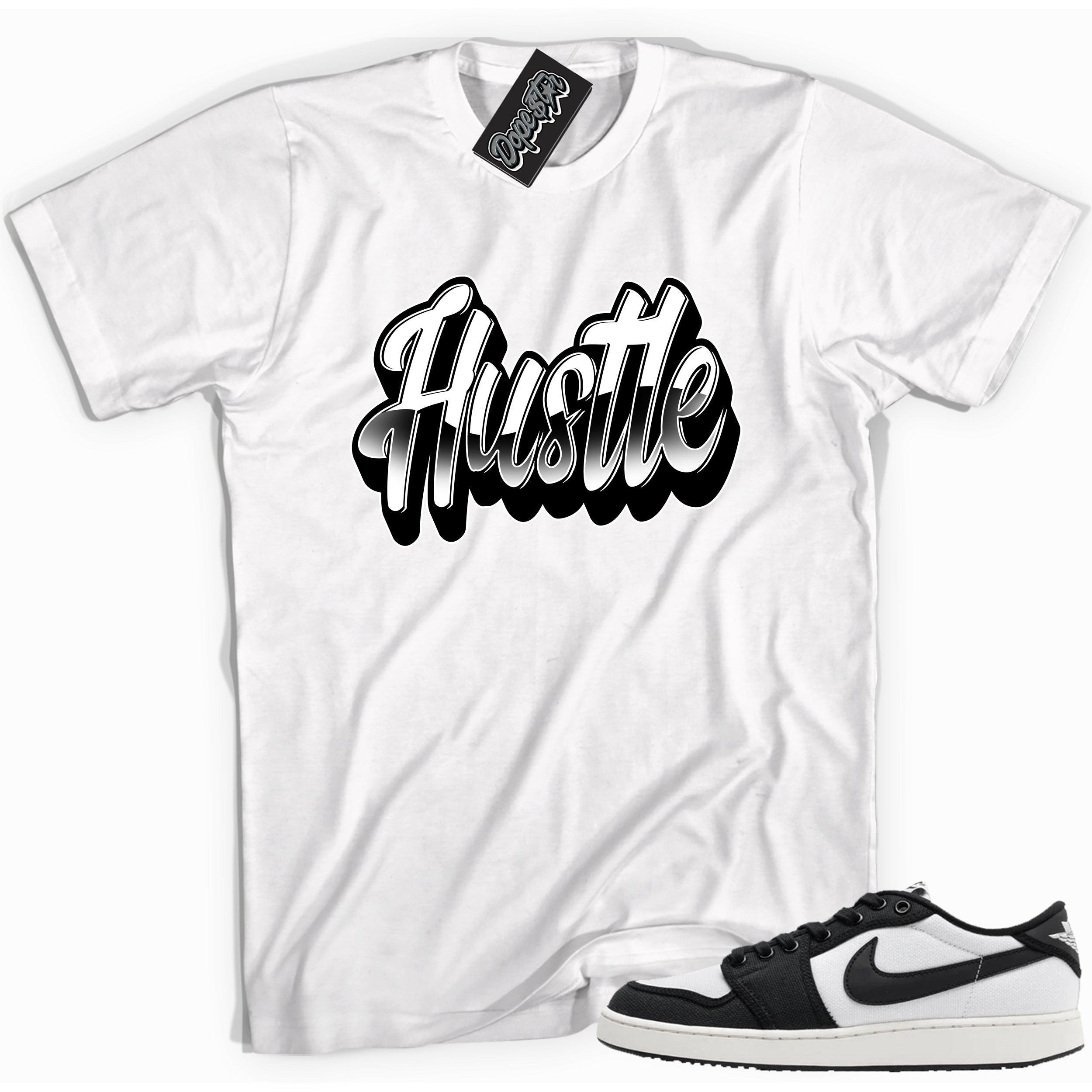 Cool white graphic tee with 'hustle' print, that perfectly matches Air Jordan 1 Retro Ajko Low Black & White sneakers.