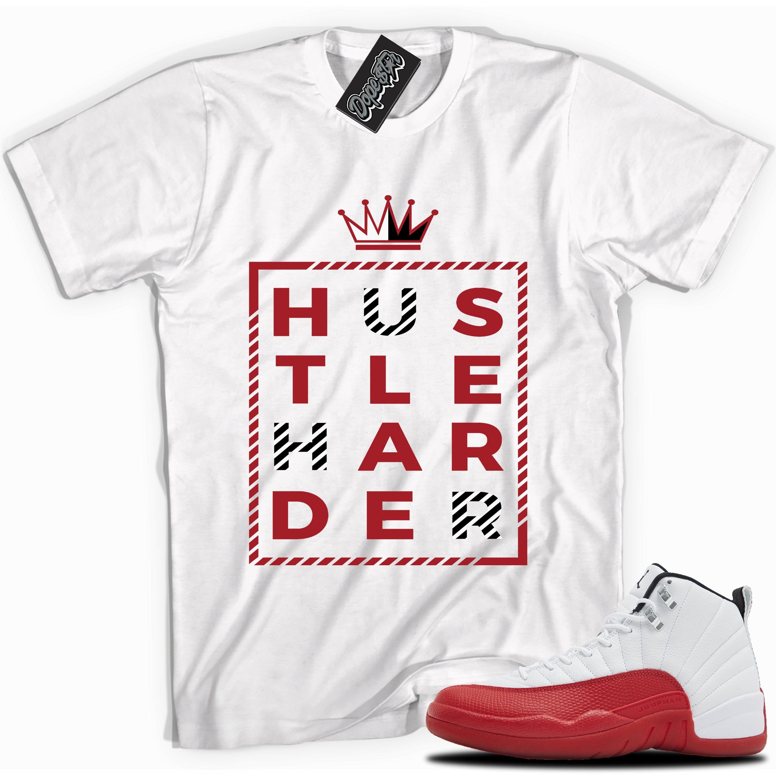 Cool White graphic tee with “ HUSTLE HARDER ” print, that perfectly matches Air Jordan 12 Retro Cherry Red 2023 red and white sneakers 