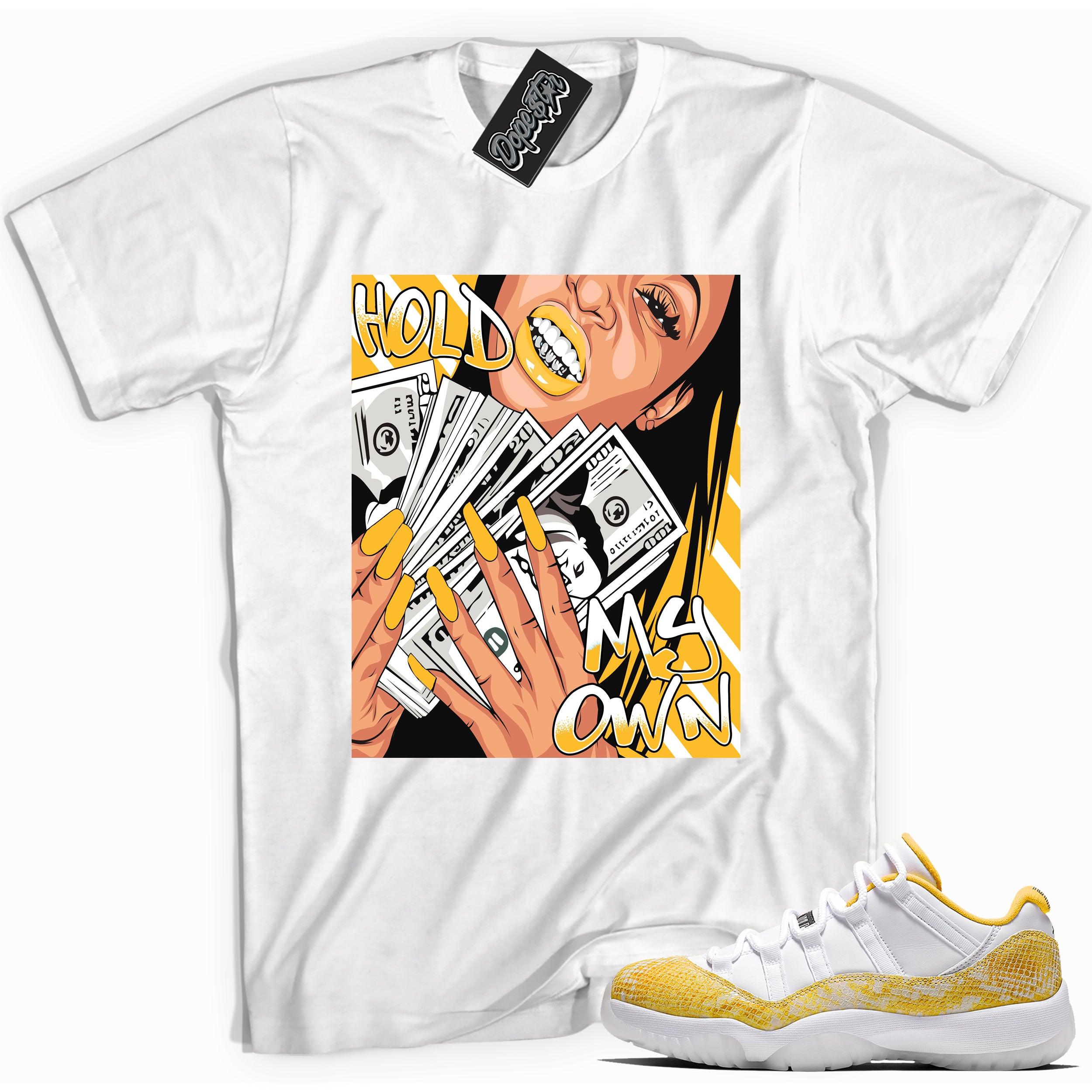 Cool white graphic tee with 'hold my own' print, that perfectly matches Air Jordan 11 Low Yellow Snakeskin sneakers