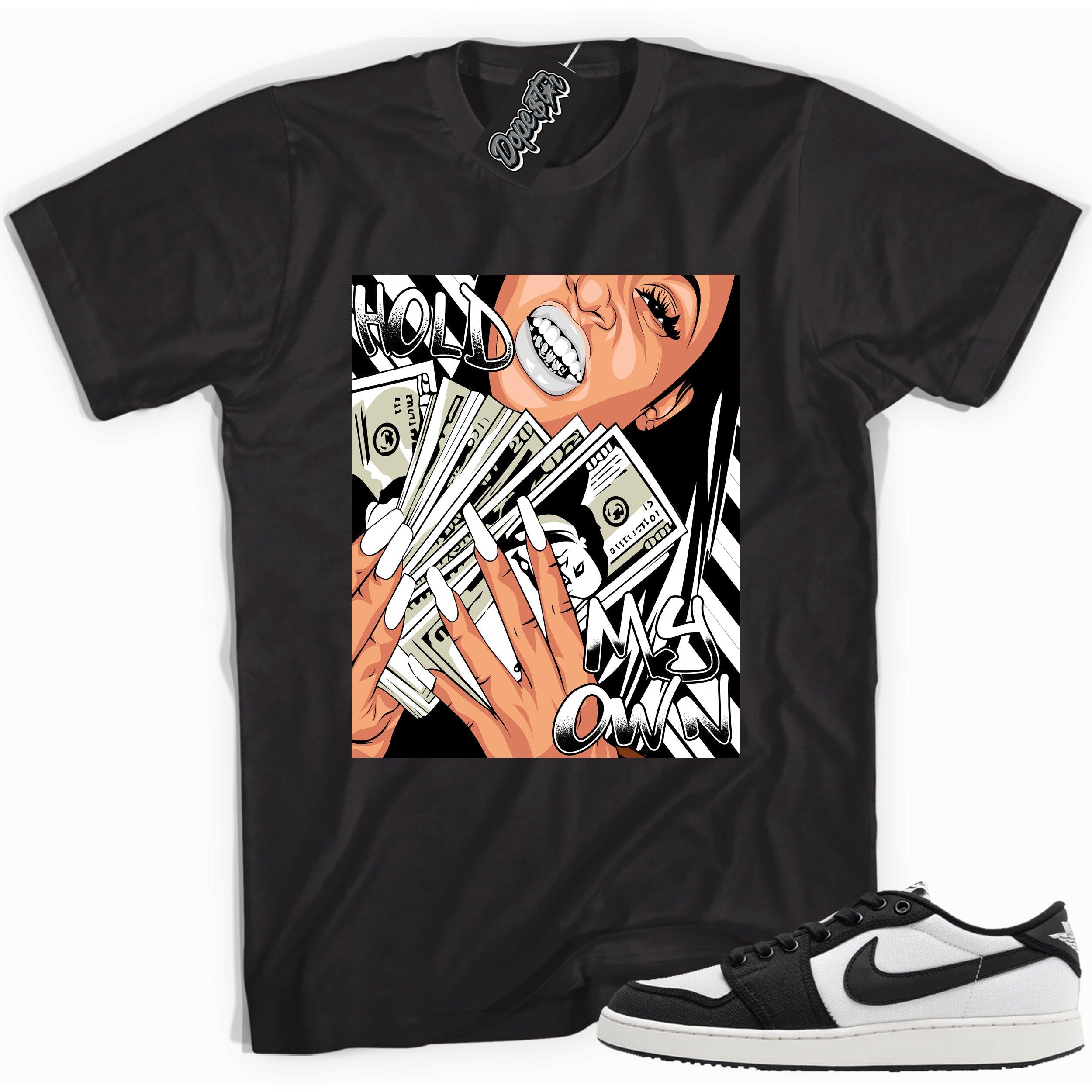 Cool black graphic tee with 'hold my own' print, that perfectly matches Air Jordan 1 Retro Ajko Low Black & White sneakers.