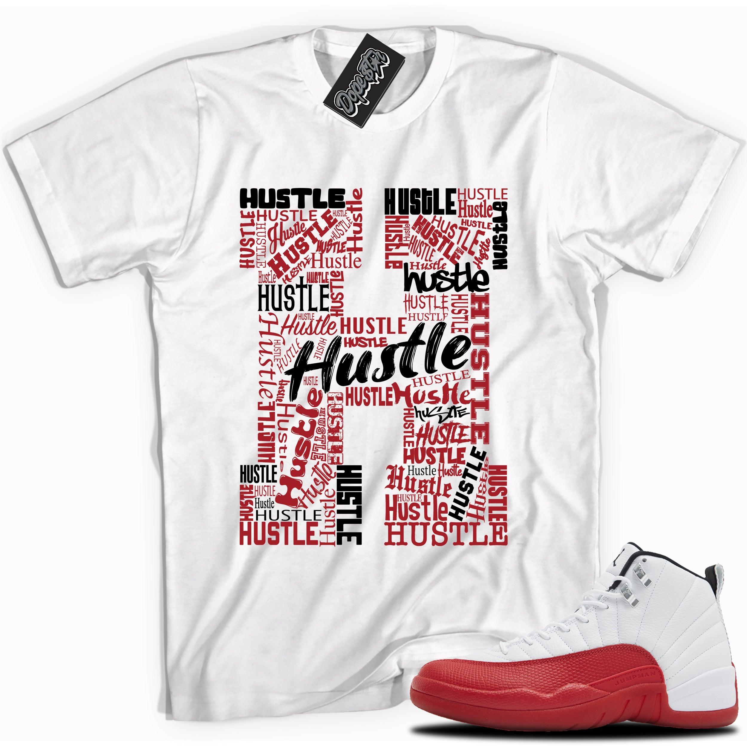 Cool White graphic tee with “  Hustle 2 ” print, that perfectly matches Air Jordan 12 Retro Cherry Red 2023 red and white sneakers