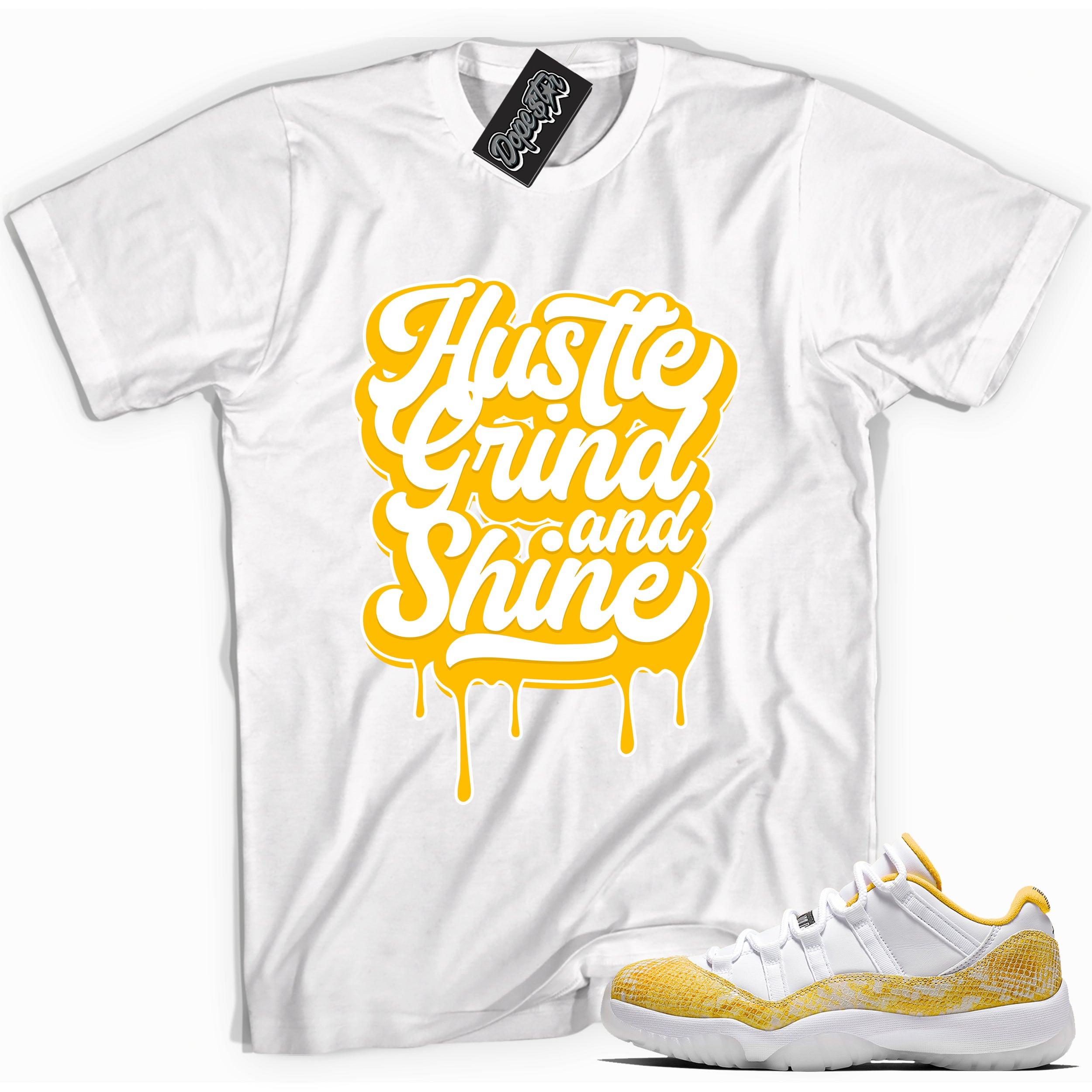 Cool white graphic tee with 'hustle grind and shine' print, that perfectly matches Air Jordan 11 Retro Low Yellow Snakeskin sneakers