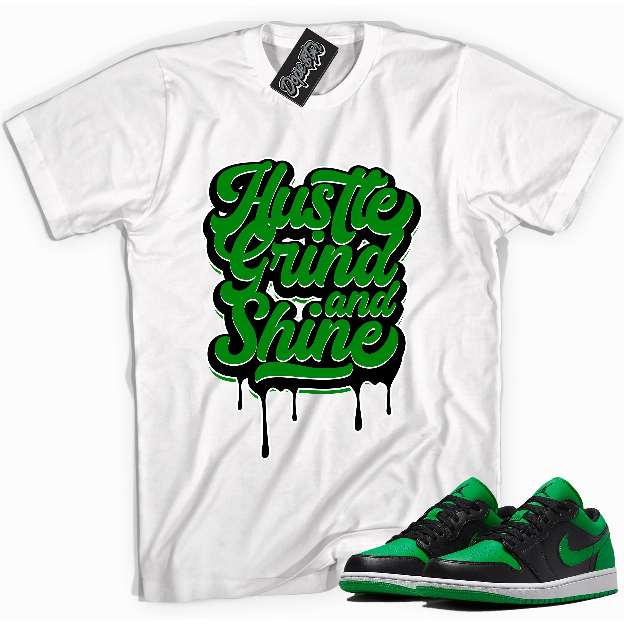 Cool white graphic tee with 'Hustle Grind & Shine' print, that perfectly matches Air Jordan 1 Low Lucky Green sneakers