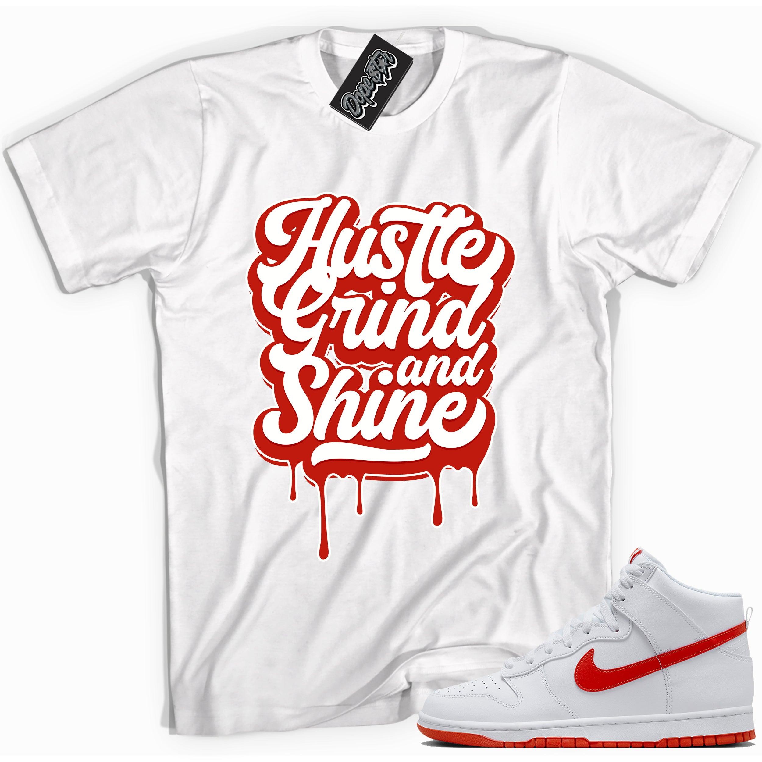 Cool white graphic tee with 'hustle grind and shine' print, that perfectly matches Nike Dunk High White Picante Red sneakers.