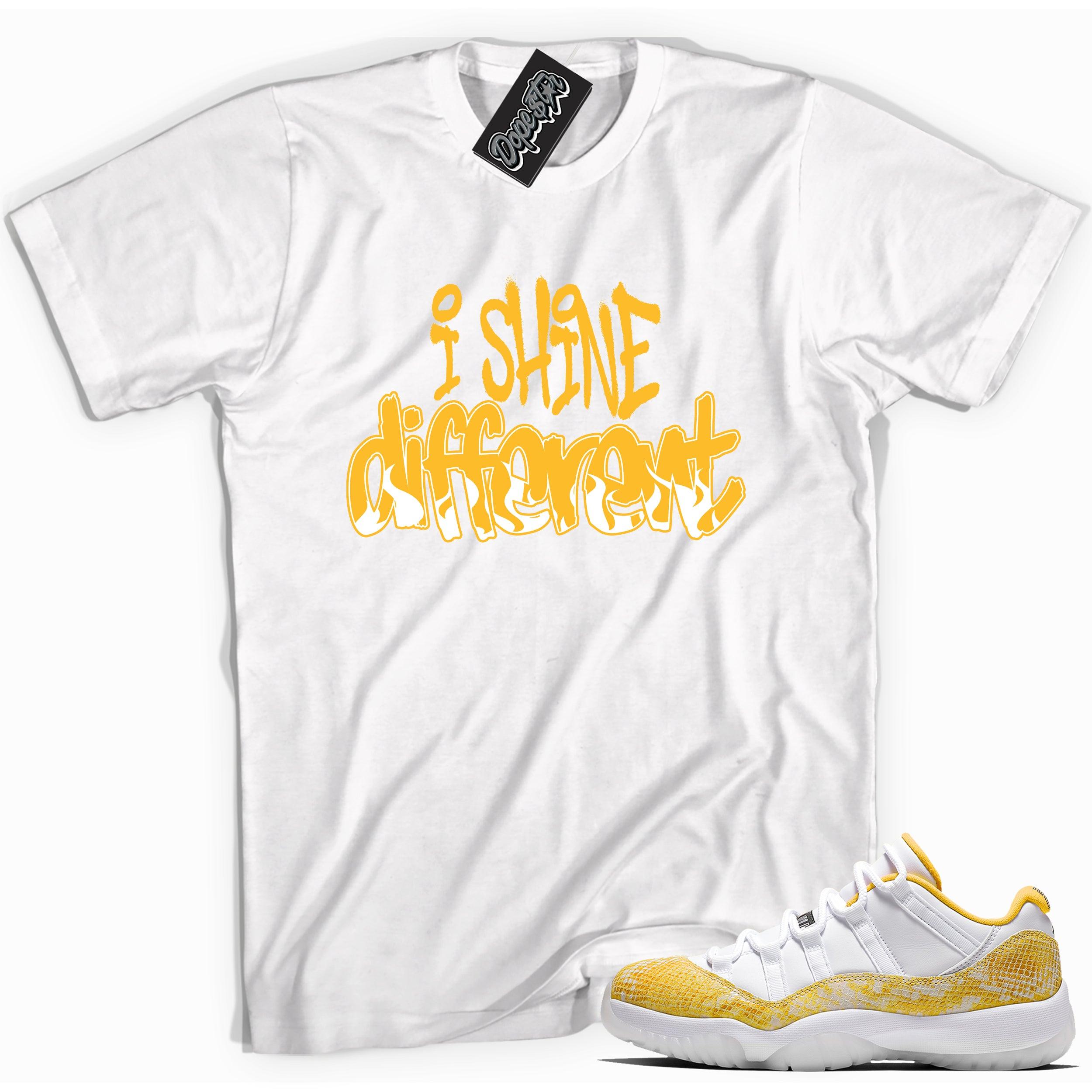 Cool white graphic tee with 'i shine different' print, that perfectly matches Air Jordan 11 Low Yellow Snakeskin sneakers