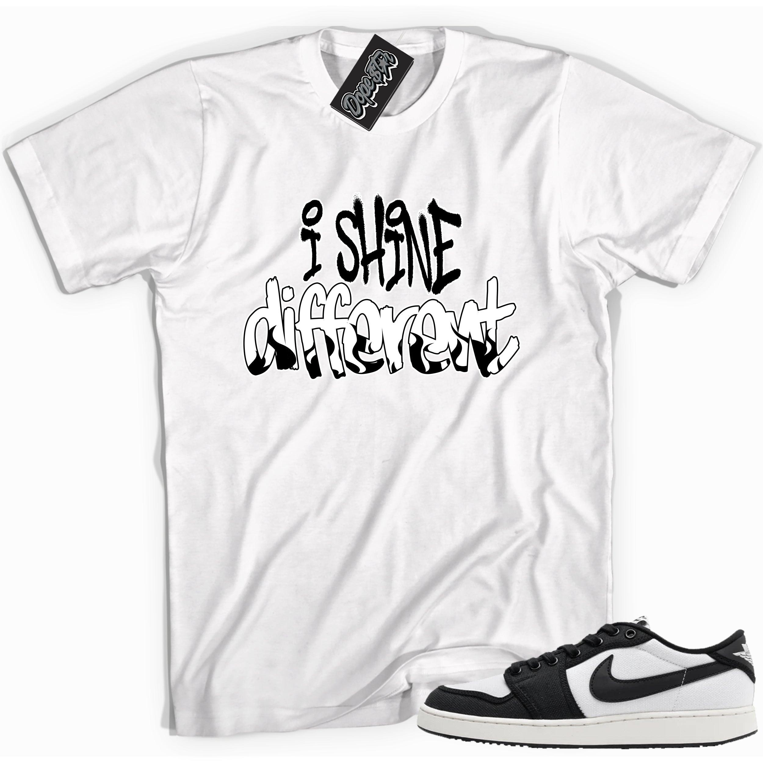 Cool white graphic tee with 'i shine different' print, that perfectly matches Air Jordan 1 Retro Ajko Low Black & White sneakers.