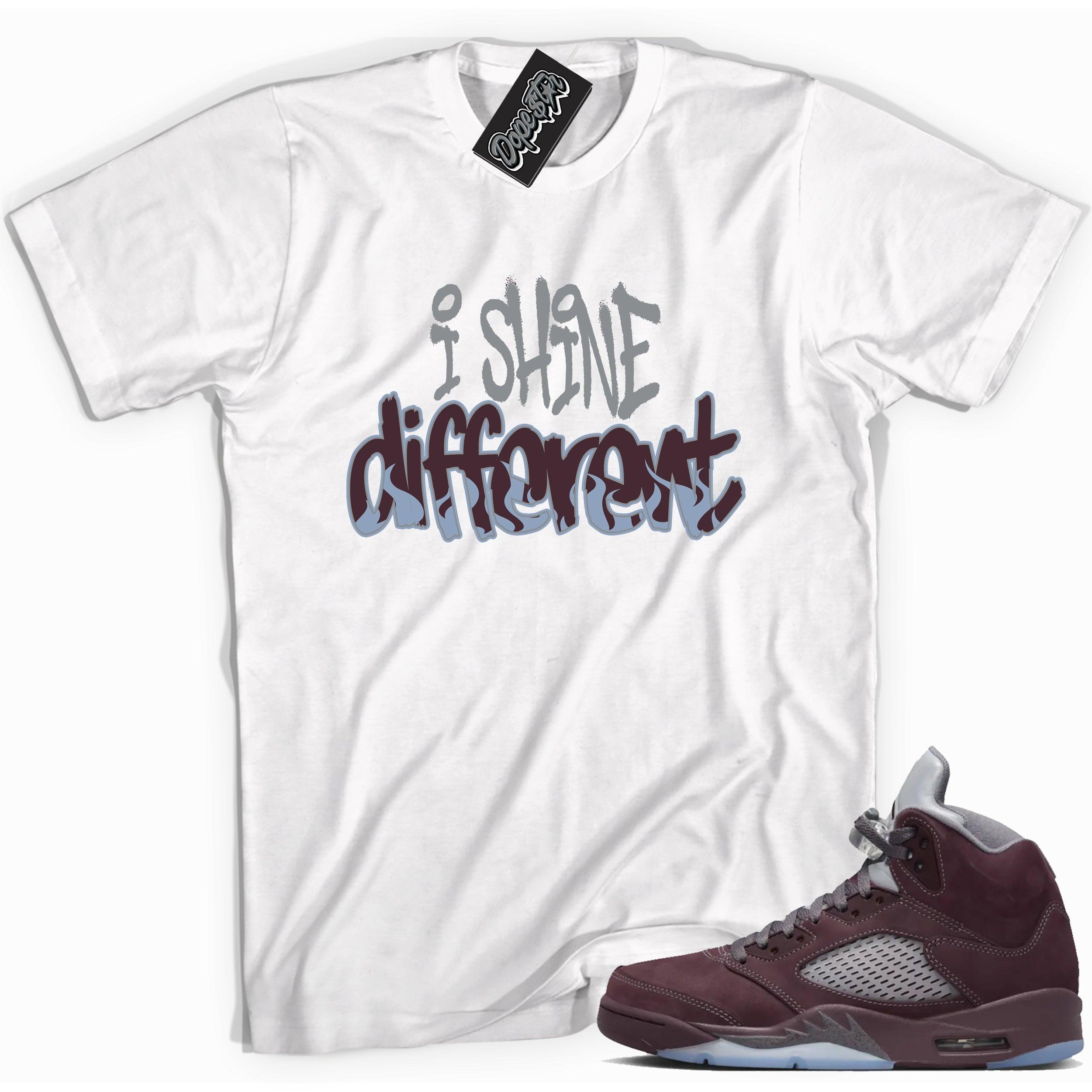 Cool White graphic tee with “  I Shine Different ” print, that perfectly matches Air Jordan 5 Burgundy 2023 sneakers 