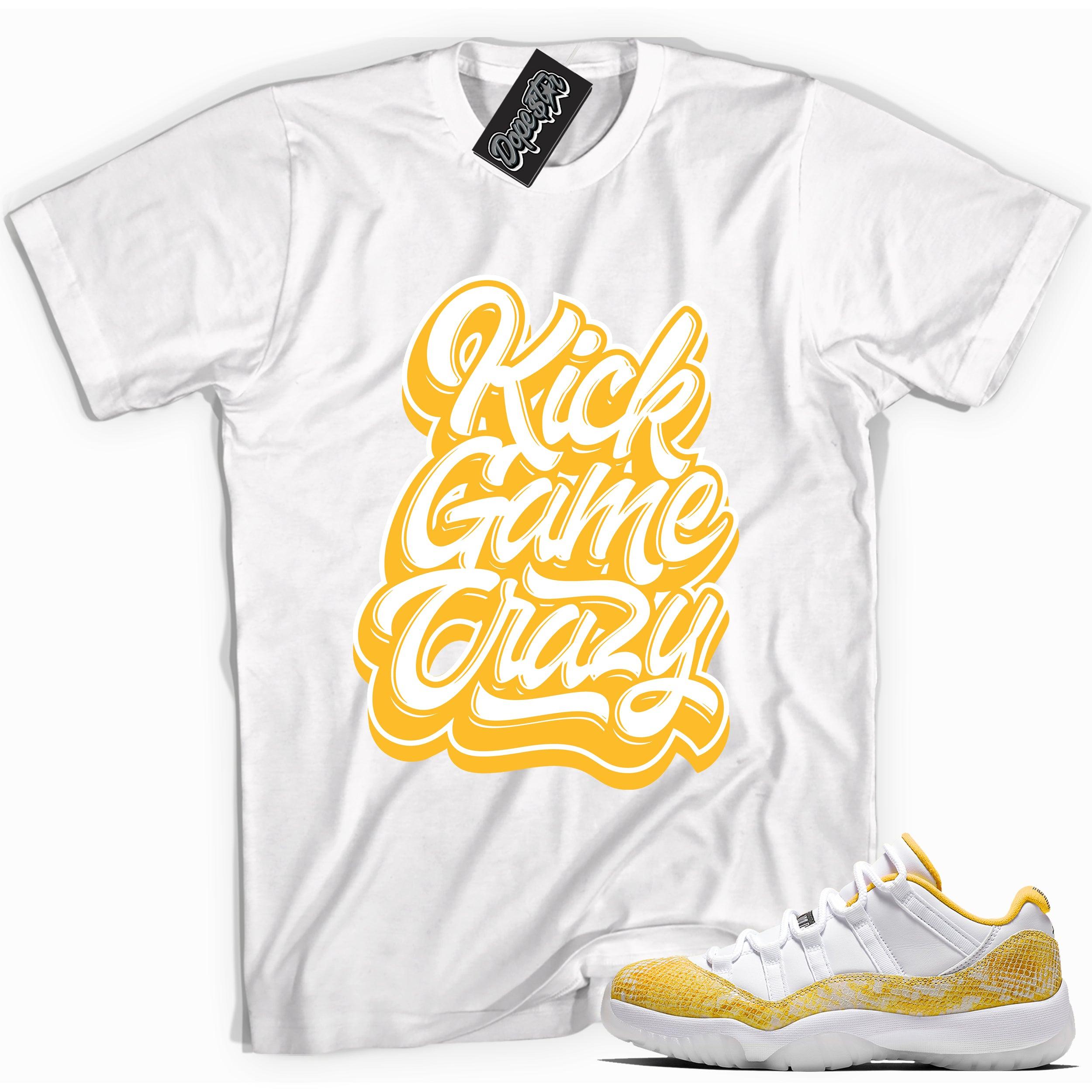 Cool white graphic tee with 'kick game crazy' print, that perfectly matches Air Jordan 11 Low Yellow Snakeskin sneakers