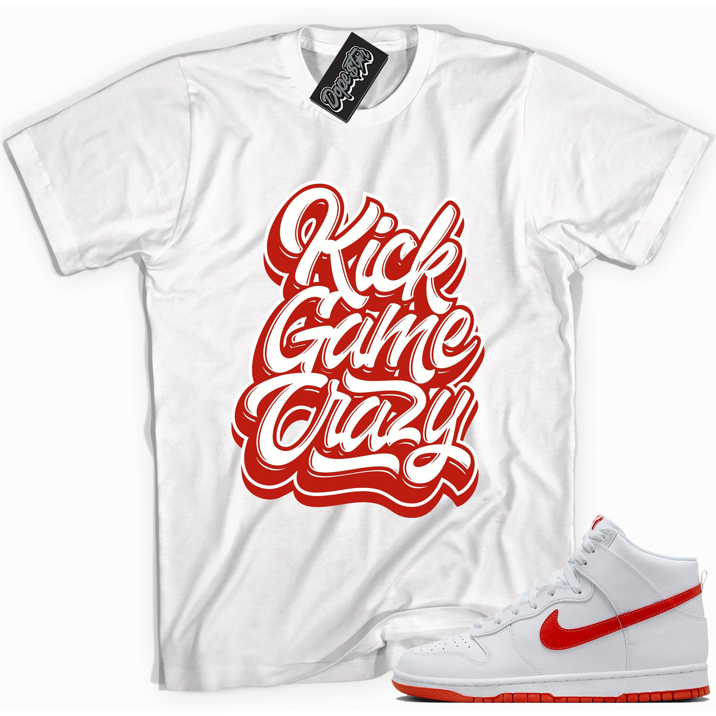 Cool white graphic tee with 'kick game crazy' print, that perfectly matches Nike Dunk High White Picante Red sneakers.