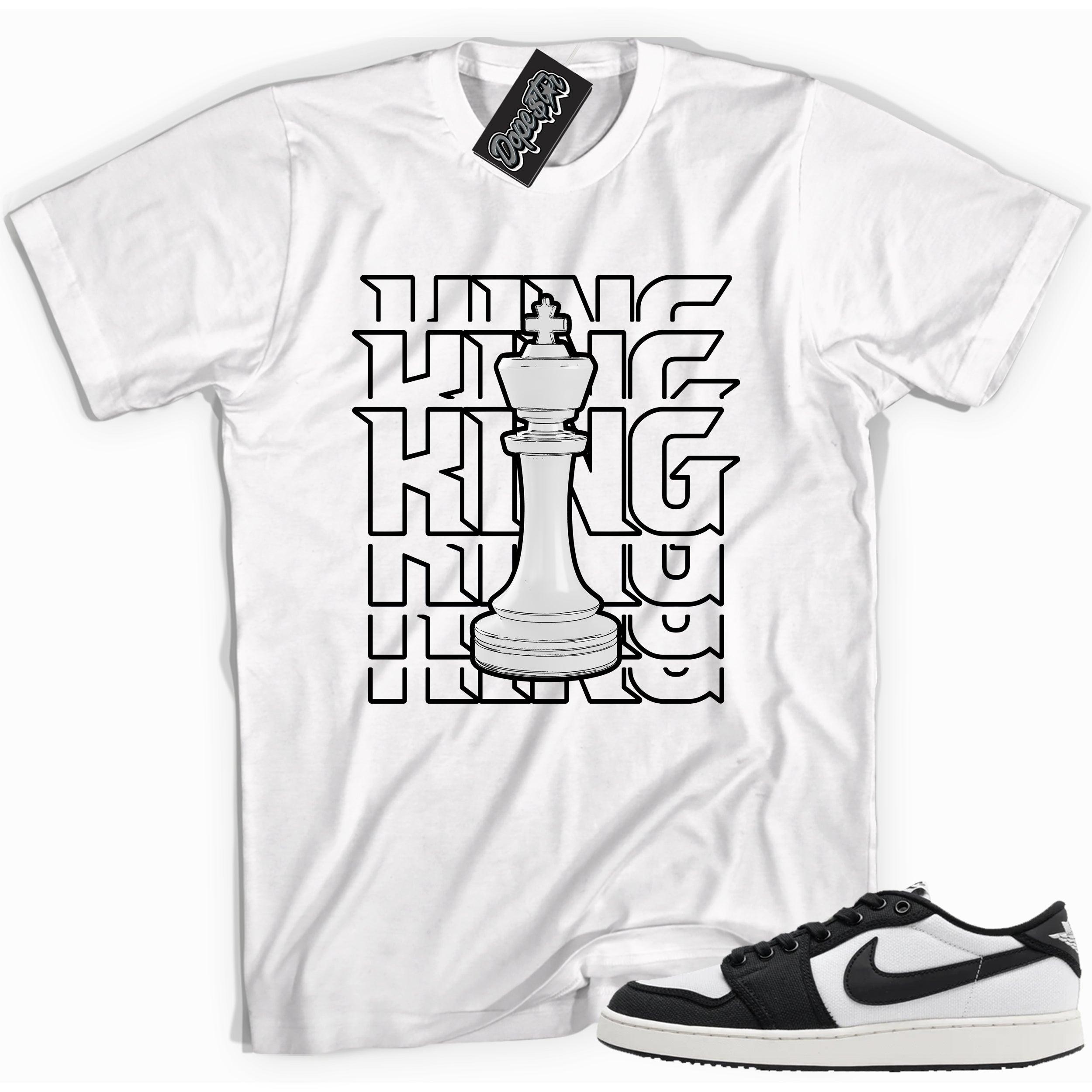 Cool white graphic tee with 'king' print, that perfectly matches Air Jordan 1 Retro Ajko Low Black & White sneakers.