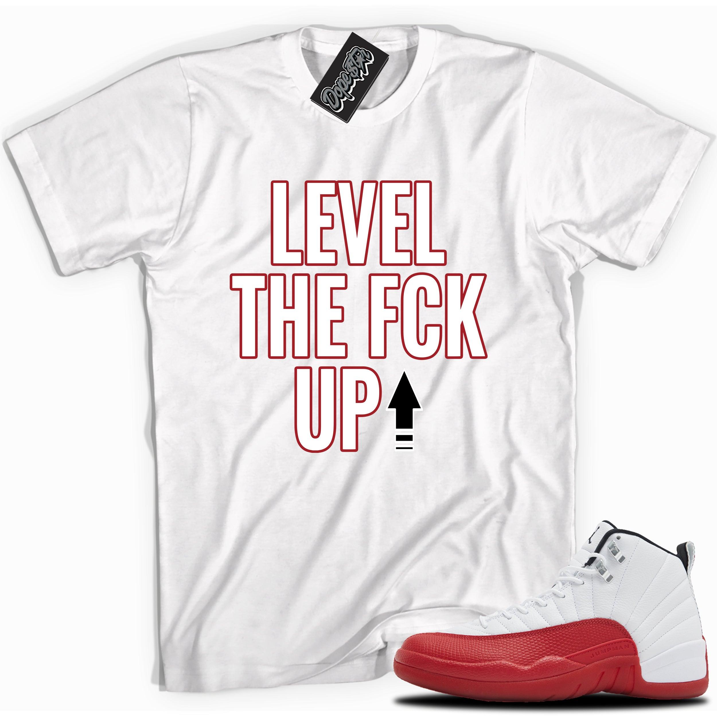Cool White graphic tee with “  Level The Fck Up ” print, that perfectly matches Air Jordan 12 Retro Cherry Red 2023 red and white sneakers 