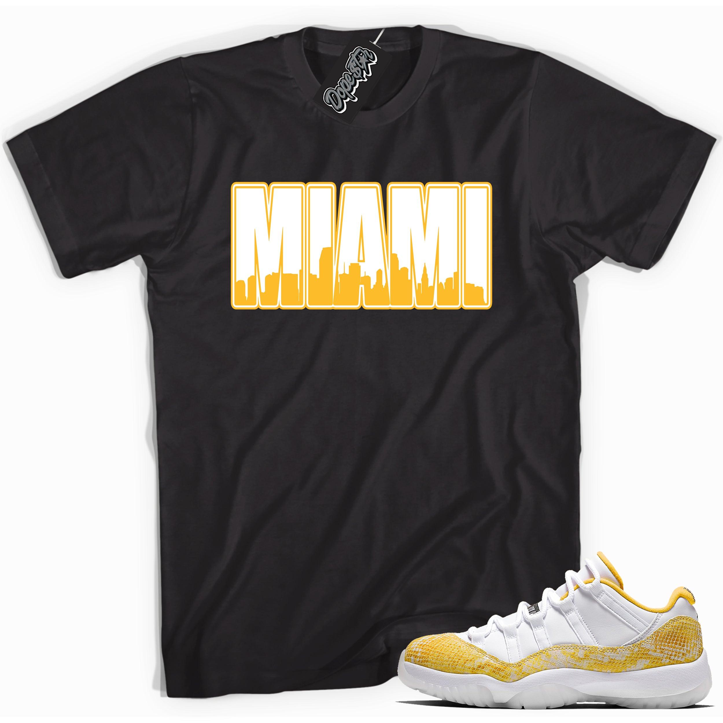 Cool black graphic tee with 'miami' print, that perfectly matches  Air Jordan 11 Low Yellow Snakeskin sneakers