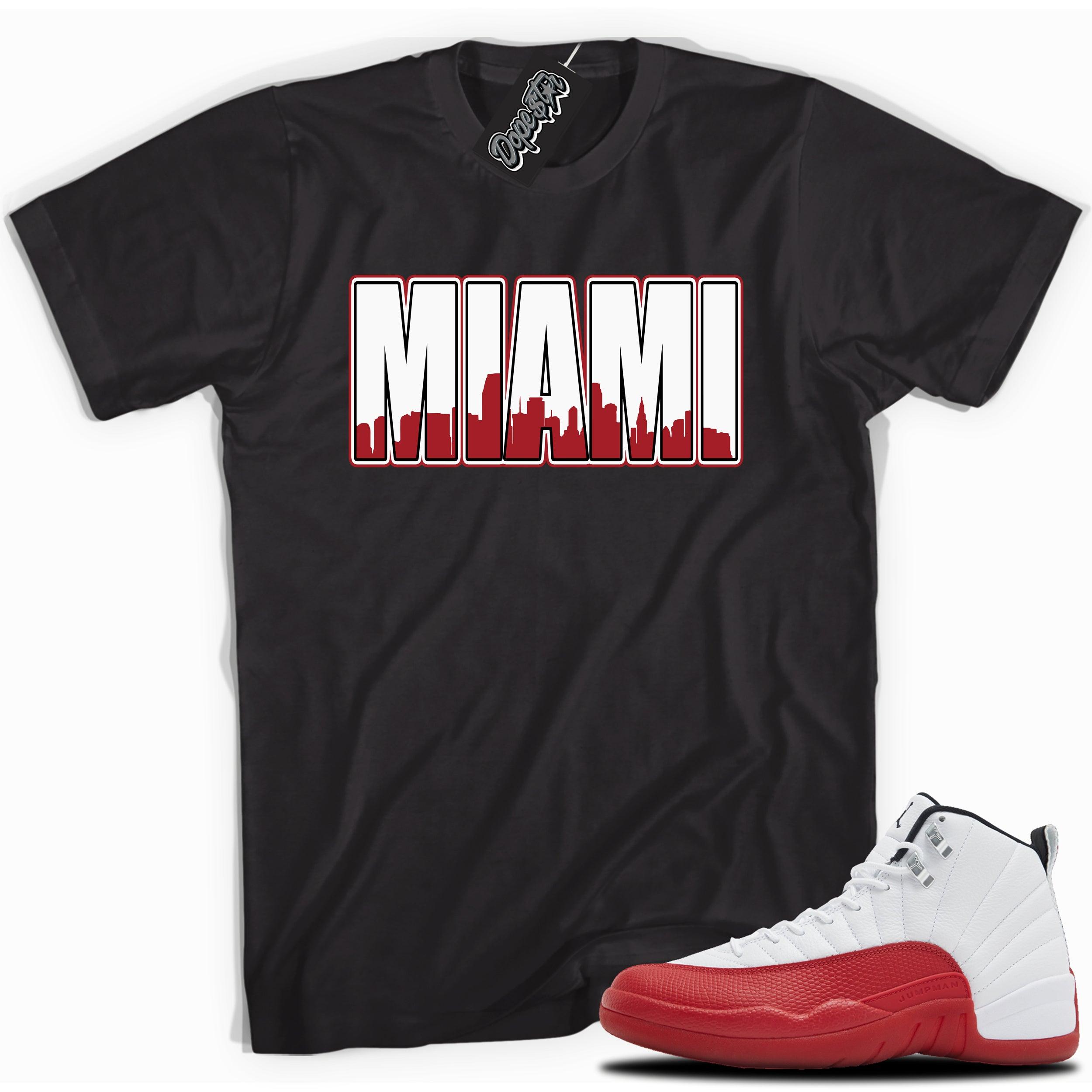 Cool Black graphic tee with “ MIAMI ” print, that perfectly matches Air Jordan 12 Retro Cherry Red 2023 red and white sneakers 