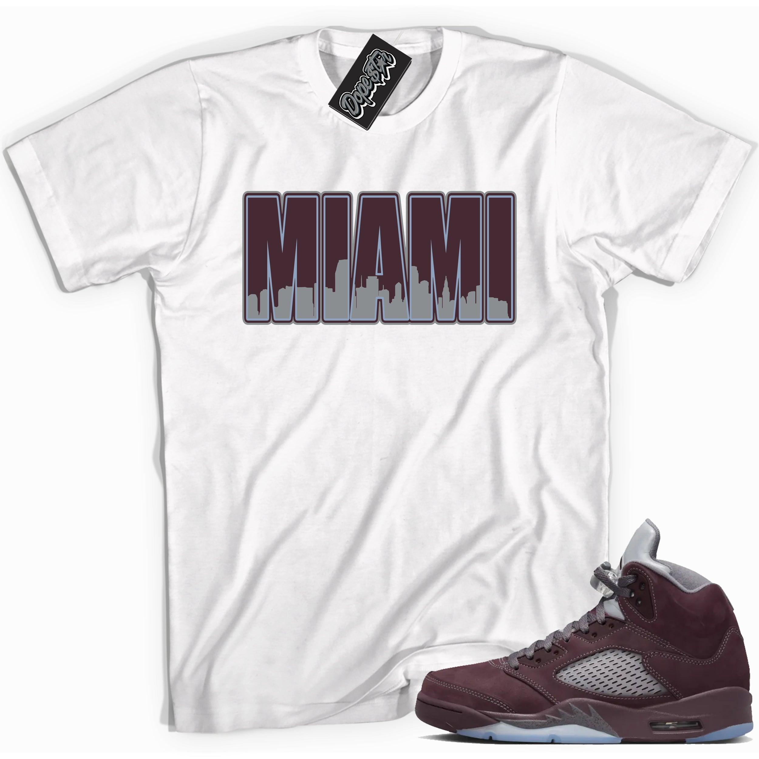 Cool White graphic tee with “ MIAMI  ” print, that perfectly matches Air Jordan 5 Burgundy 2023 sneakers 