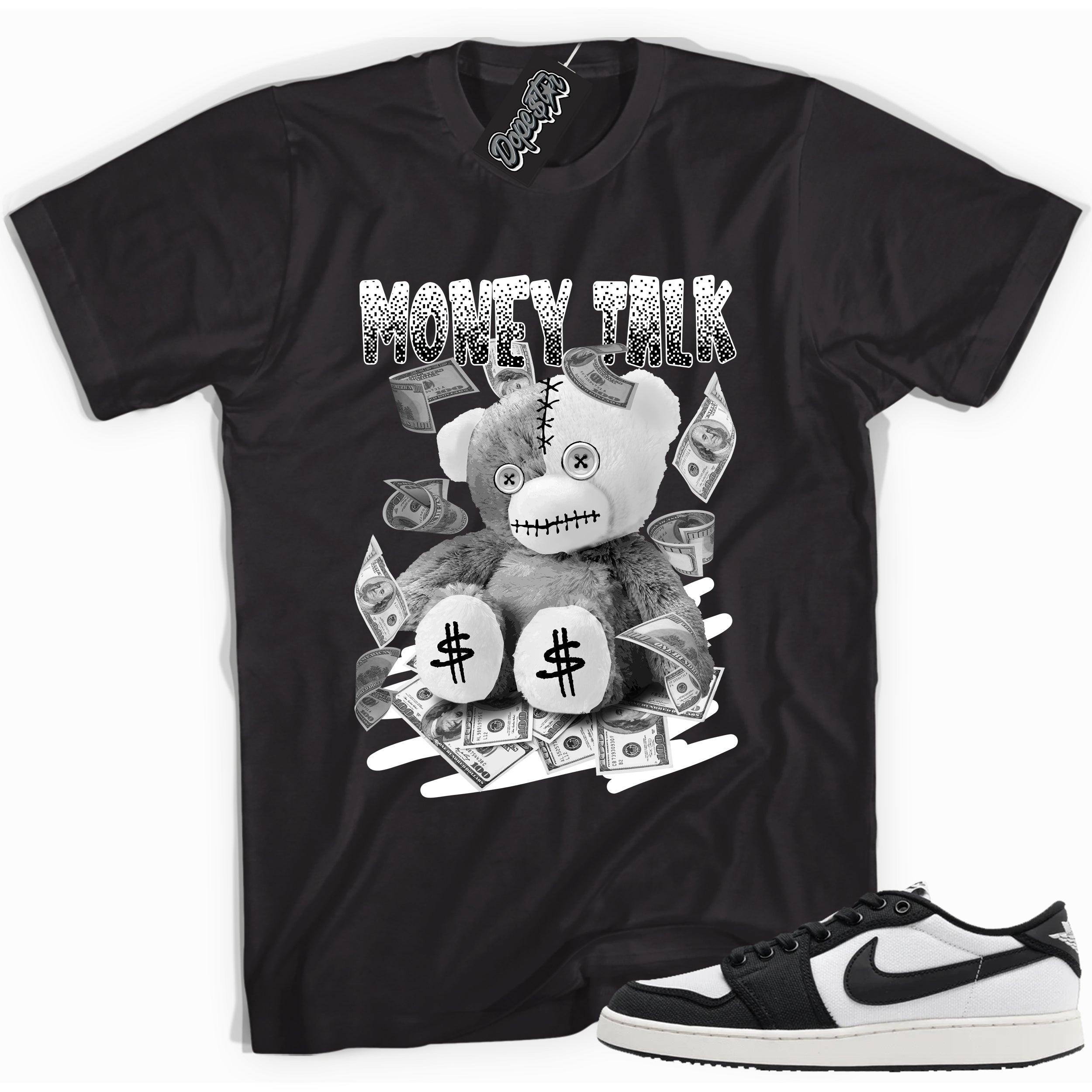 Cool black graphic tee with 'money talk bear' print, that perfectly matches Air Jordan 1 Retro Ajko Low Black & White sneakers.