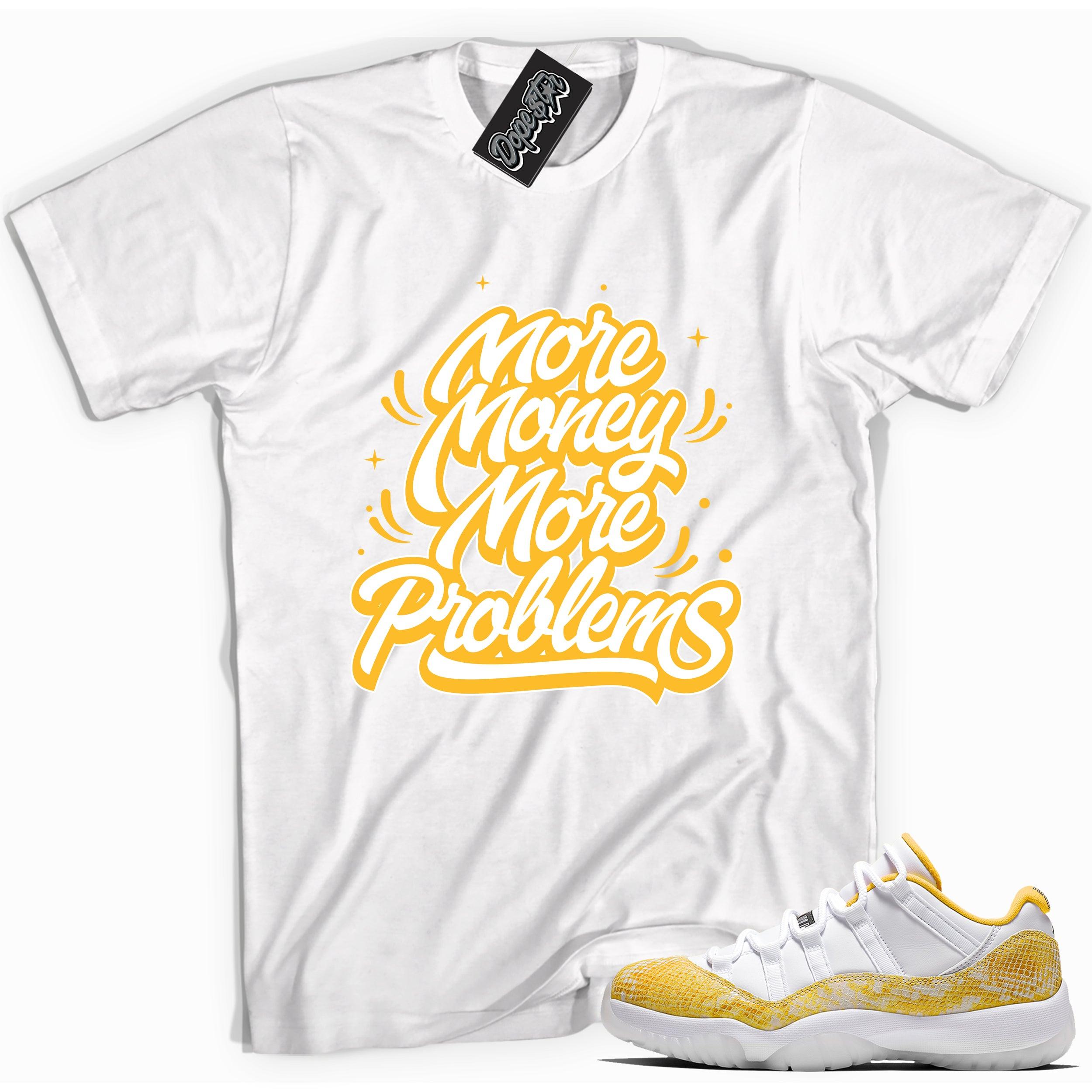 Cool white graphic tee with 'more money more problems' print, that perfectly matches Air Jordan 11 Low Yellow Snakeskin sneakers