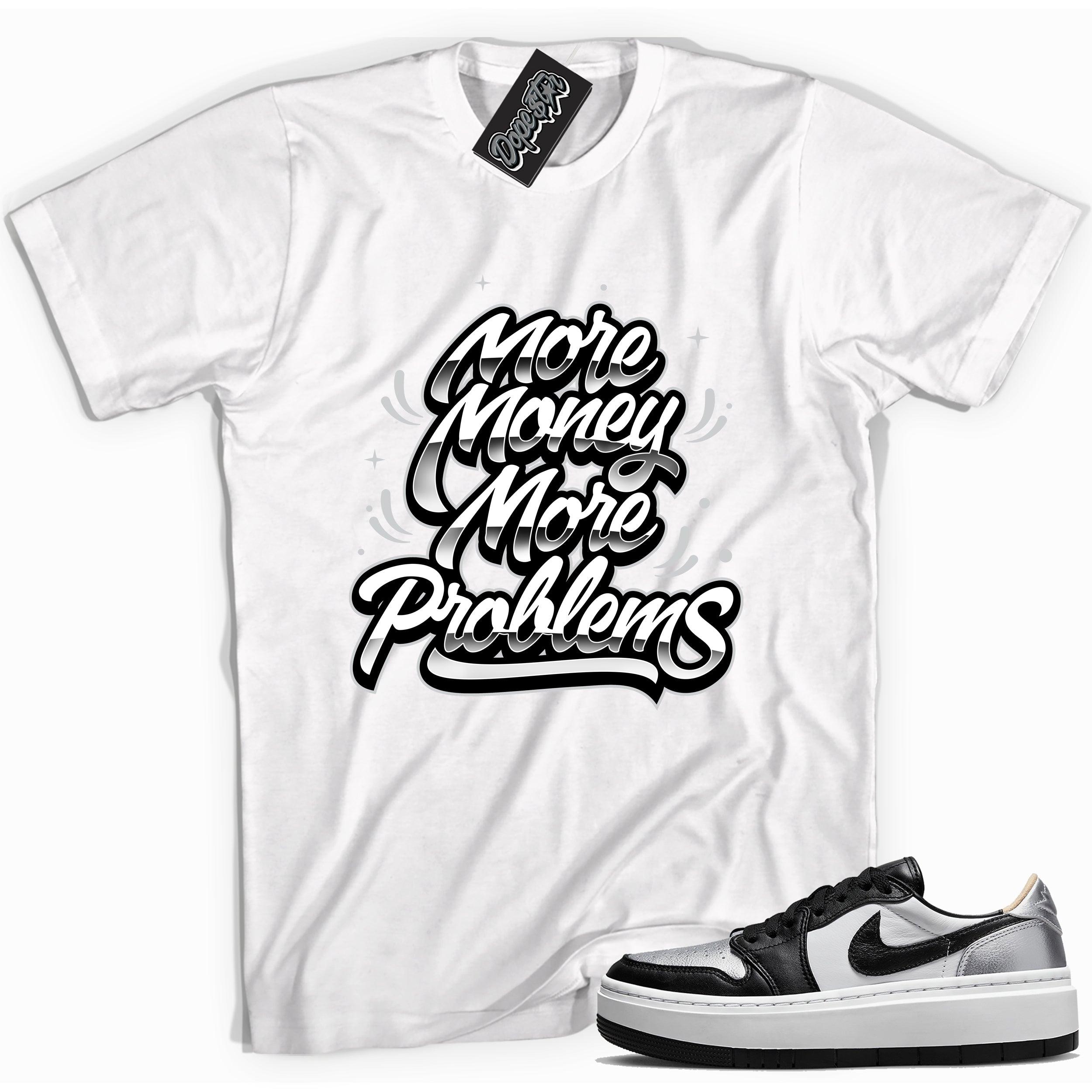 Cool white graphic tee with 'more money more problems' print, that perfectly matches Air Jordan 1 Elevate Low SE Silver Toe sneakers.
